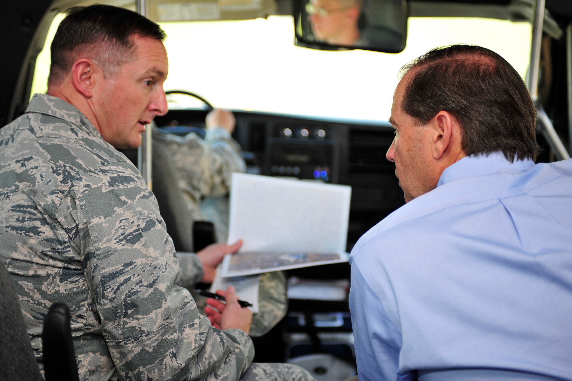 Col. Stephen Clark, 27th Special Operations Wing commander, highlights points of interest to U.S. Sen. Tom Udall, D-NM, during a tour of Cannon Air Force Base. Sen. Udall viewed recent and planned construction sites at the base during a brief visit June 10.  (US Air Force Photo by Technical Sgt. Josef Cole) 
