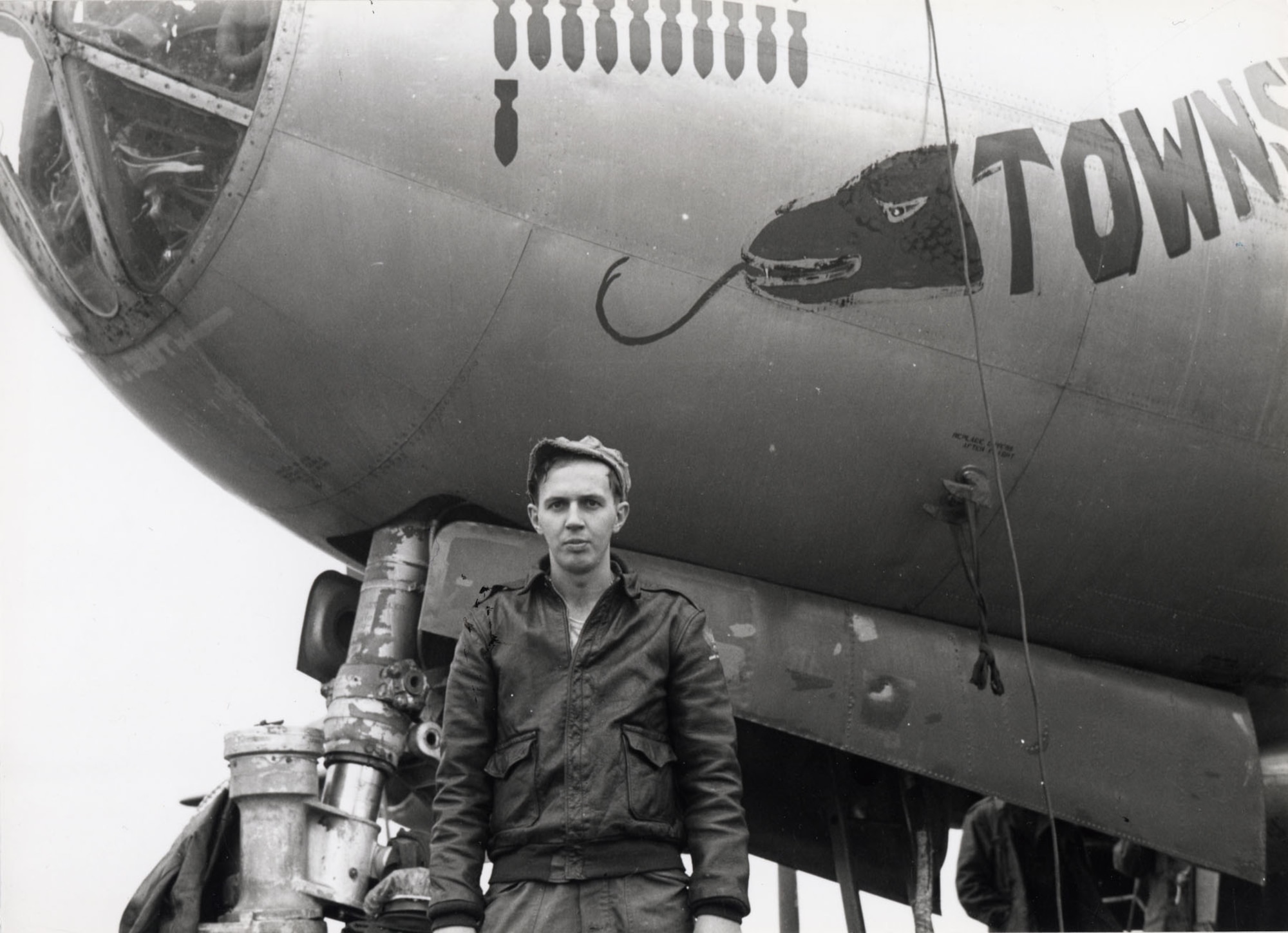 Sgt. Don Beck standing in front of "Townswick’s Terrors," wearing the jacket now on display at the National Museum of the U.S. Air Force. (U.S. Air Force photo)