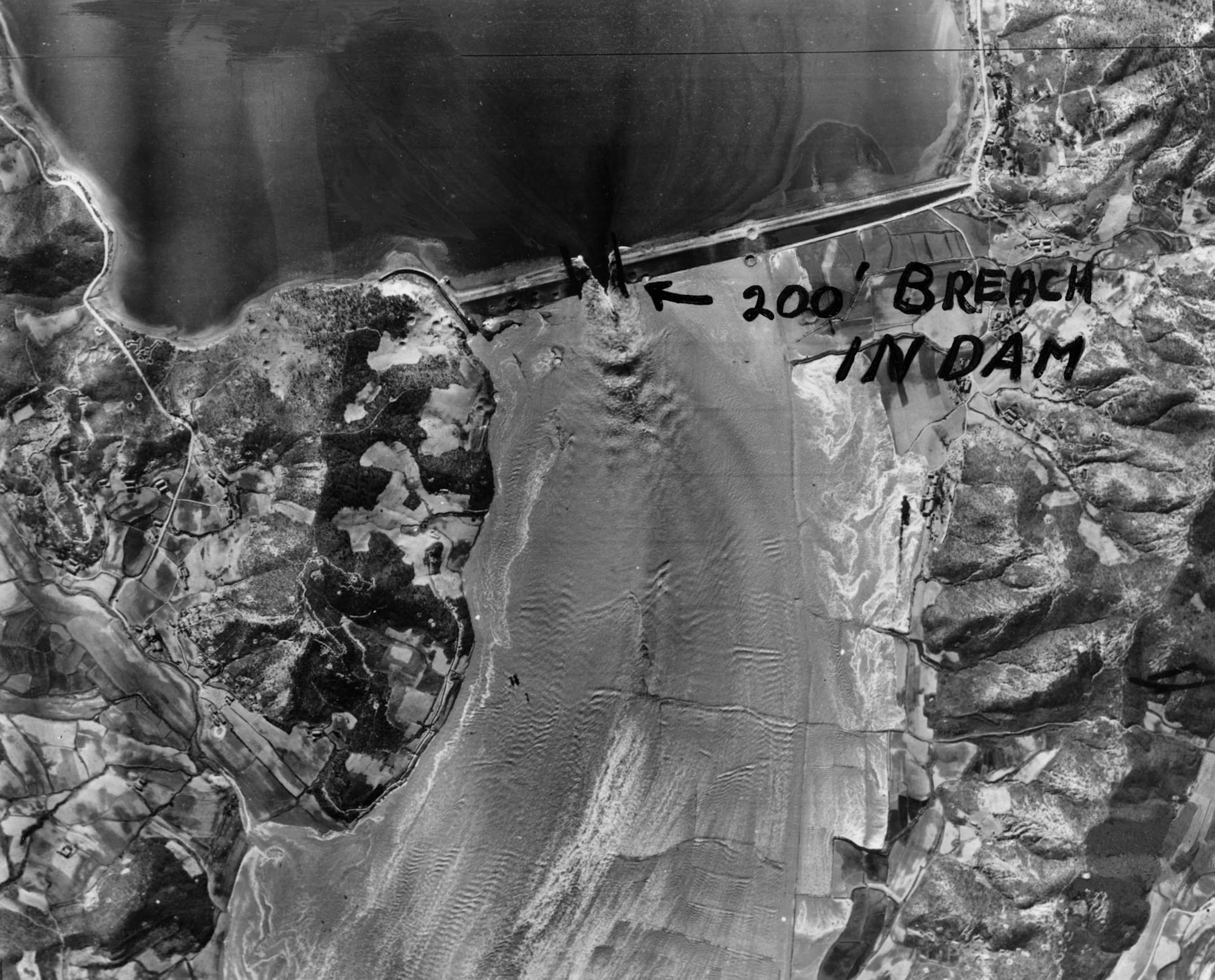 On May 16, 1953, F-84s scored several direct hits against the 230-ft thick Chasan Dam 25 miles north of Pyongyang, releasing a devastating flood. The torrent of water that raced down the valley washed out everything in its path, including roads, train tracks and two rail bridges. (U.S. Air Force photo)