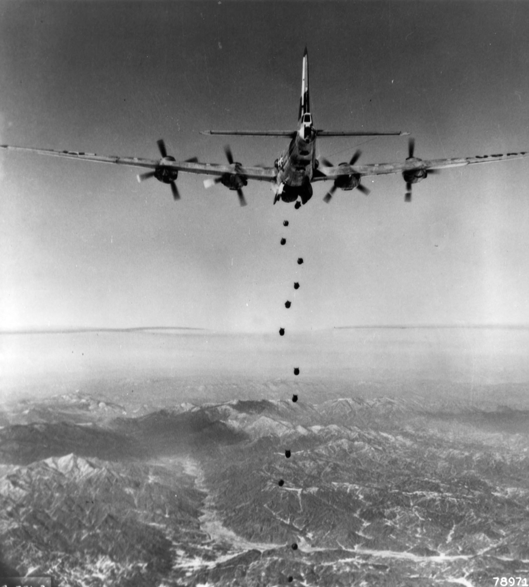Lead 19th Bomb Group B-29 begins the bombing attack against a target in North Korea in February 1951. (U.S. Air Force photo)