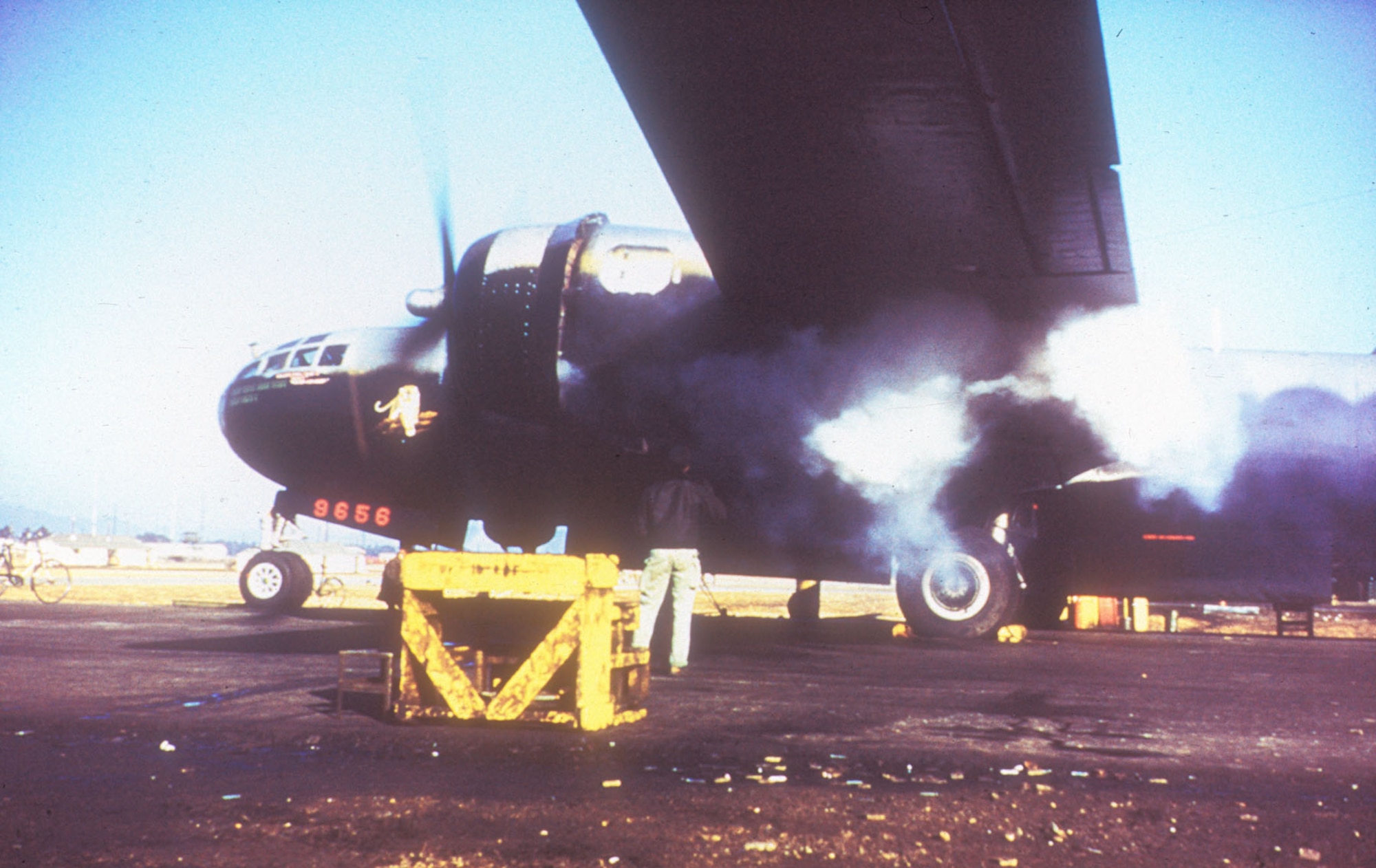 Belching smoke, engine No. 1 roars into life in preparation for takeoff. (U.S. Air Force photo)