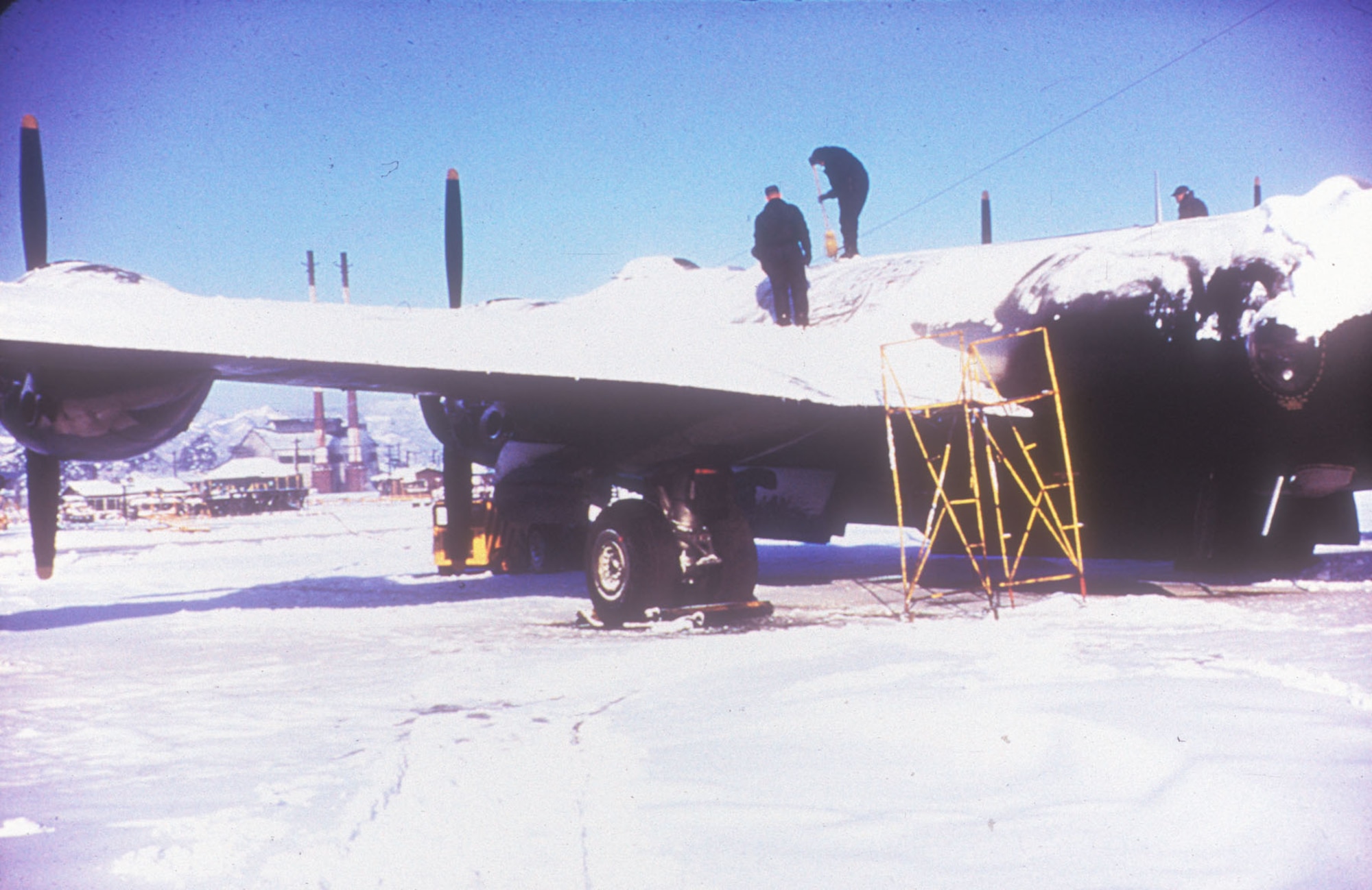 Sometimes mission preparation involved clearing the previous night's snow off the aircraft. (U.S. Air Force photo)