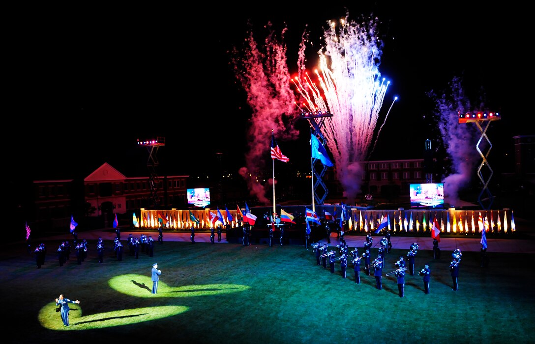The United States Air Force Honor Guard and Band perform during the Conference of American Air Chiefs Twilight Tattoo June 13 at the U.S. Air Force Ceremonial Lawn on Bolling Air Force Base. Gen. Norton A. Schwartz, U.S. Air Force chief of staff, hosted the event celebrating "50 Years of Friendship and Cooperation" between nations belonging to the System of Cooperation among American Air Forces. (U.S. Air Force photo by Airman 1st Class Katherine Windish)
