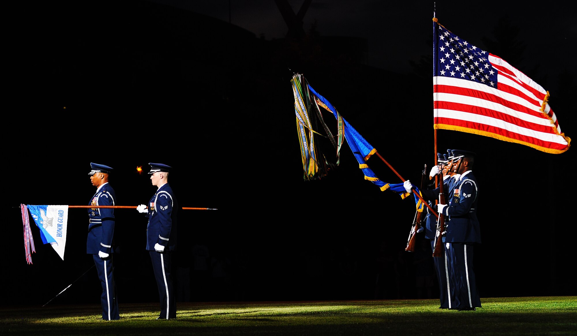 A United States Air Force Honor Guard color guard element presents the colors during the Conference of American Air Chiefs Twilight Tattoo June 13 at the U.S. Air Force Ceremonial Lawn on Bolling Air Force Base. Gen. Norton A. Schwartz, U.S. Air Force chief of staff, hosted the event celebrating "50 Years of Friendship and Cooperation" between nations belonging to the System of Cooperation among American Air Forces. U.S. Air Force photo by Airman 1st Class Katherine Windish)