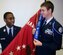 HAMPTON, Va. -- Cadets from Hampton High School's Air Force Junior ROTC unit proudly display the 2009-2010 Distinguished Unit Award with Merit streamer from the unit guidon June 8. The unit received award for outstanding service to the school and surrounding community. (Photo courtesy/Maj. Paul Willard)