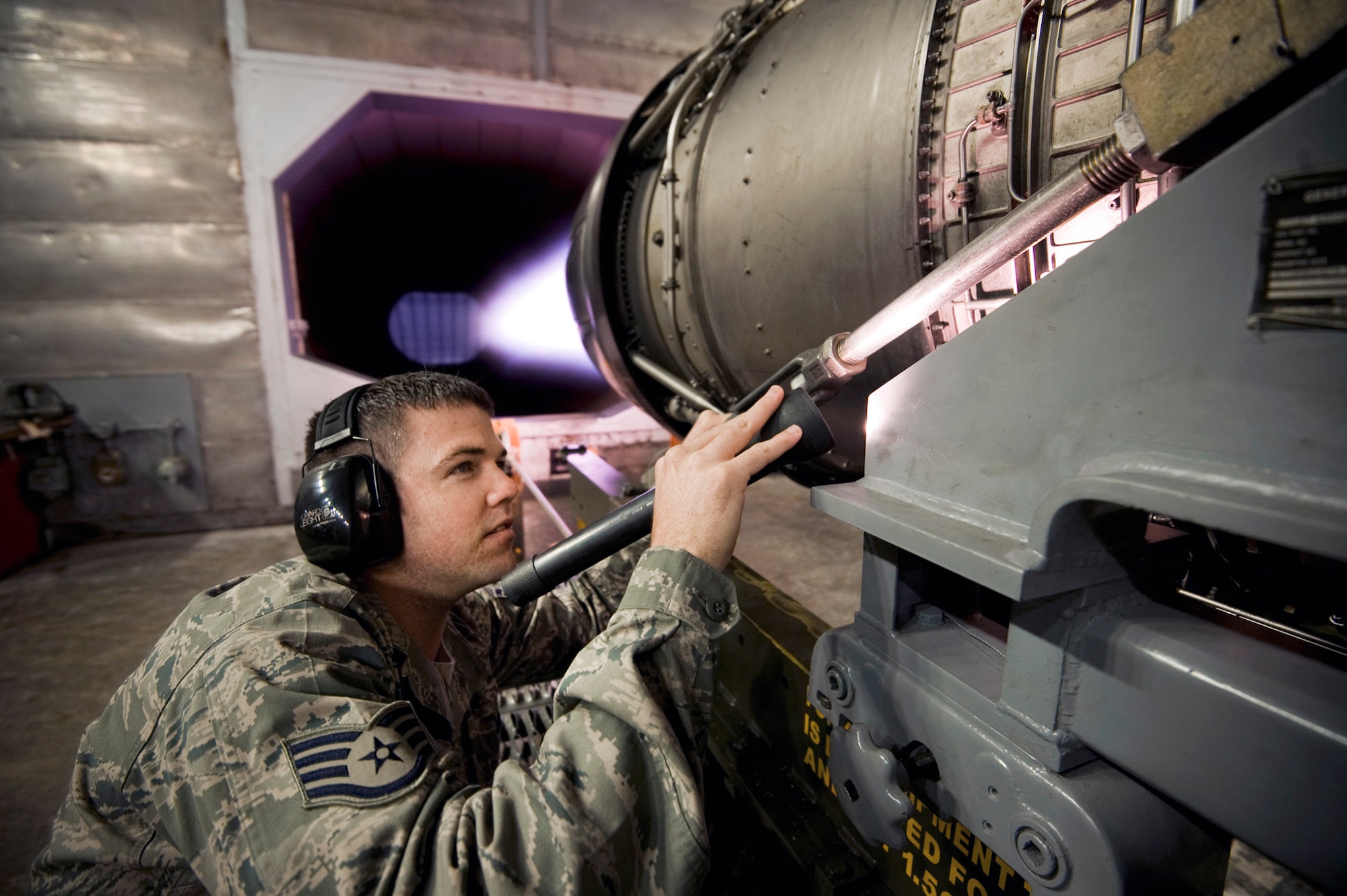 Staff Sgt. Chris Browne inspects the engine from an F-16 Fighting Falcon in the hush house May 27, 2010, at Misawa Air Base, Japan. The hush house allows maintainers to test and inspect the jet engines before returning them to the flightline. Sergeant Browne is a 35th Maintenance Squadron aerospace propulsion test cell technician. (U.S. Air Force photo/Staff Sgt. Samuel Morse)