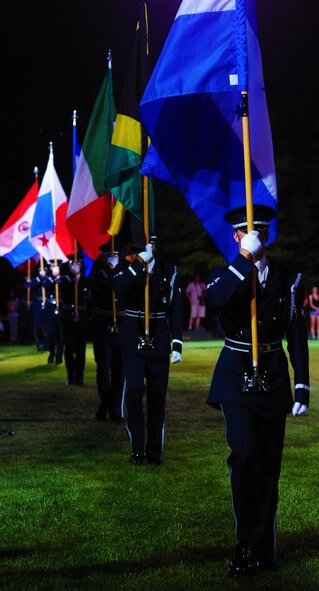 United States Air Force Honor Guard members carry the flags of System of Cooperation among American Air Forces member nations during the Conference of American Air Chiefs Twilight Tattoo June 13 at the U.S. Air Force Ceremonial Lawn on Bolling Air Force Base. Gen. Norton A. Schwartz, U.S. Air Force chief of staff, hosted the event celebrating "50 Years of Friendship and Cooperation" between nations belonging to SICOFAA. (U.S. Air Force photo by Airman 1st Class Katherine Windish)