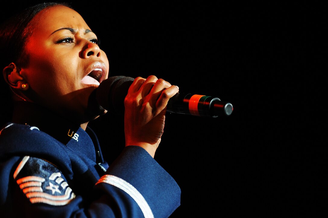 Master Sgt. Regina Coonrod, United States Air Force Band, performs with Max Impact during the Conference of American Air Chiefs Twilight Tattoo June 13 at the U.S. Air Force Ceremonial Lawn on Bolling Air Force Base. Gen. Norton A. Schwartz, U.S. Air Force chief of staff, hosted the event celebrating "50 Years of Friendship and Cooperation" between nations belonging to the System of Cooperation among American Air Forces. (U.S. Air Force photo by Airman 1st Class Katherine Windish)