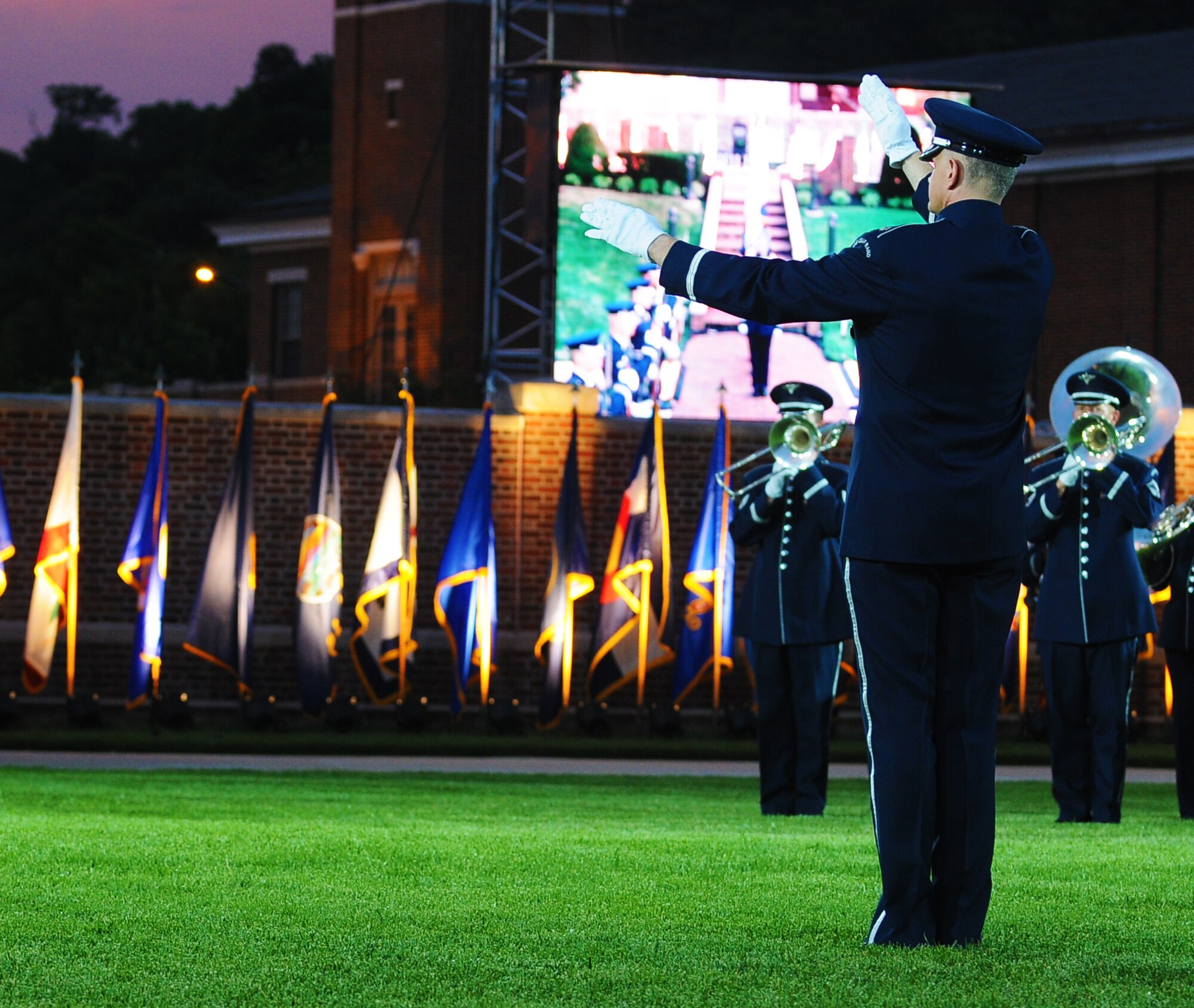 Lt. Col. A. Philip Waite, United States Air Force Band commander, conducts the Air Force Band’s Ceremonial Brass element during the Conference of American Air Chiefs Twilight Tattoo June 13 at the U.S. Air Force Ceremonial Lawn on Bolling Air Force Base. Gen. Norton A. Schwartz, U.S. Air Force chief of staff, hosted the event celebrating "50 Years of Friendship and Cooperation" between nations belonging to the System of Cooperation among American Air Forces. This was Colonel Waite’s debut performance as commander and conductor of the Air Force Band.