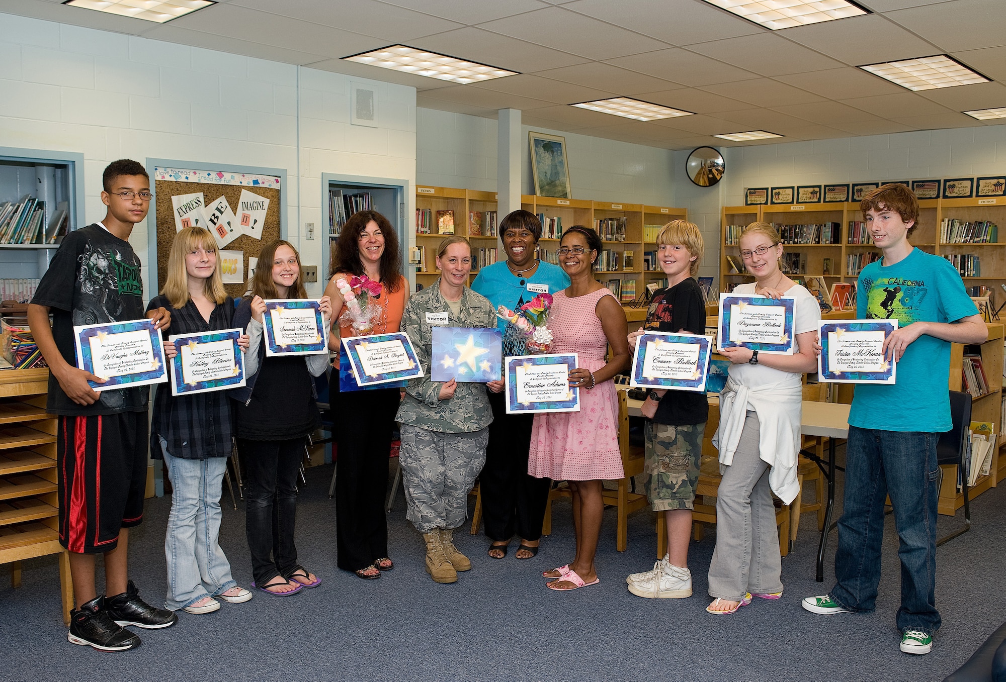 The Children?s Families Dealing with Separation and Deployment class display their diplomas following the graduation ceremony in May. The program helps children who have a parent deployed or soon to deploy cope with the trials of a separated family. This program was started with the assistance of Ernestine Adams, Dover Air Force Base Middle School principal, and Deborah Bryant, school counselor.  This program is facilitated by Tech. Sgt. Stacy Boos, 436th Force Support Squadron Readiness NCO, from the Airman and Family Readiness Center.  (U.S. Air Force photo by Jason Minto / Released)