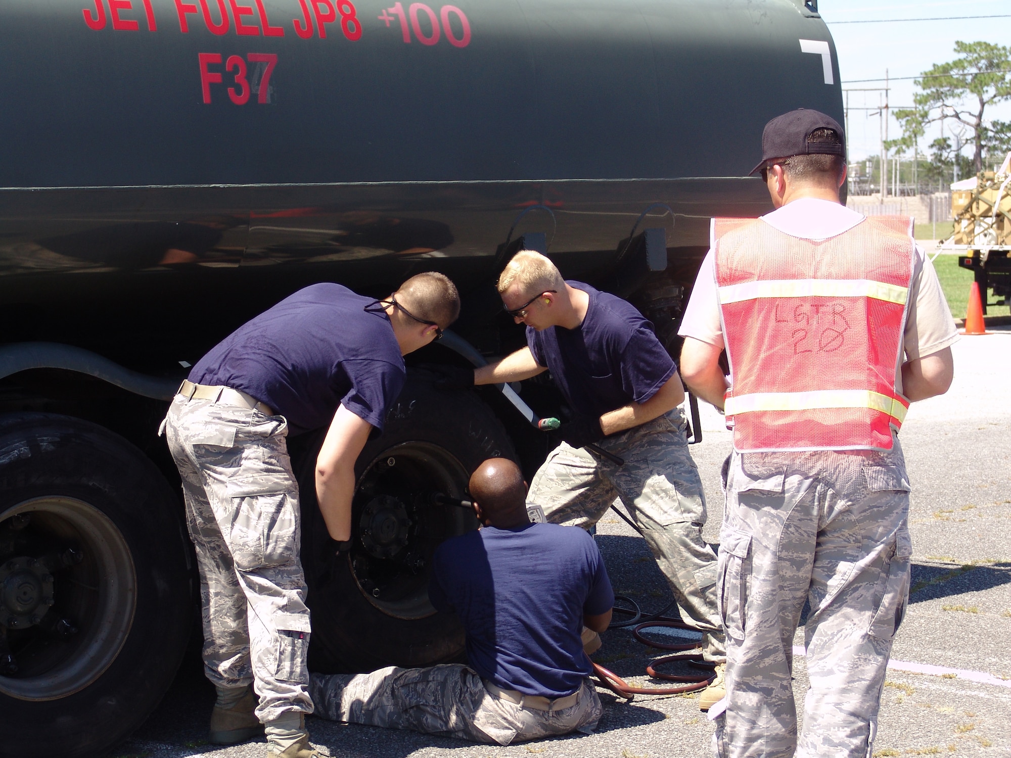 The Blue Team change a tire as part of the 96th Logistics Readiness Squadron's ROADEO June 11. (USAF photo/Lois Walsh)
