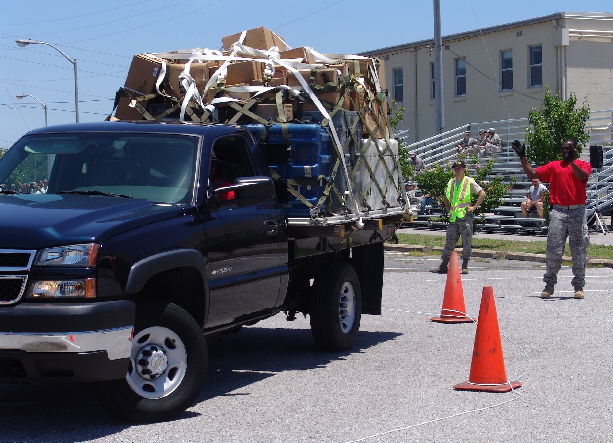 A member of the Red Team instructs a driver as he backs up during the 96th Logistic Readiness Squadron's ROADEO June 11. (USAF photo/Lois Walsh)