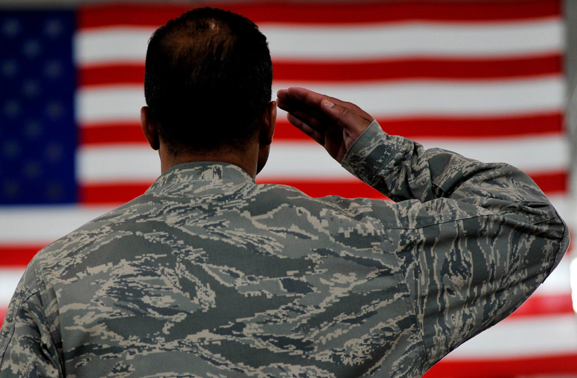 JOINT BASE MCGUIRE-DIX-LAKEHURST, N.J. – Lt. Col. Tom Highsmith, 816th Ground Mobility Squadron director of operations, renders a final salute to his outgoing squadron commander, Lt. Col. Vikki Ellison, during the inactivation ceremony of the 816th Contingency Response Group here June 11. The inactivation will boost the capabilities of the wing’s two remaining Contingency Response Groups and assist with the creation of an Air National Guard CRG.  (U.S. Air Force photo/Tech. Sgt. Parker Gyokeres/released)