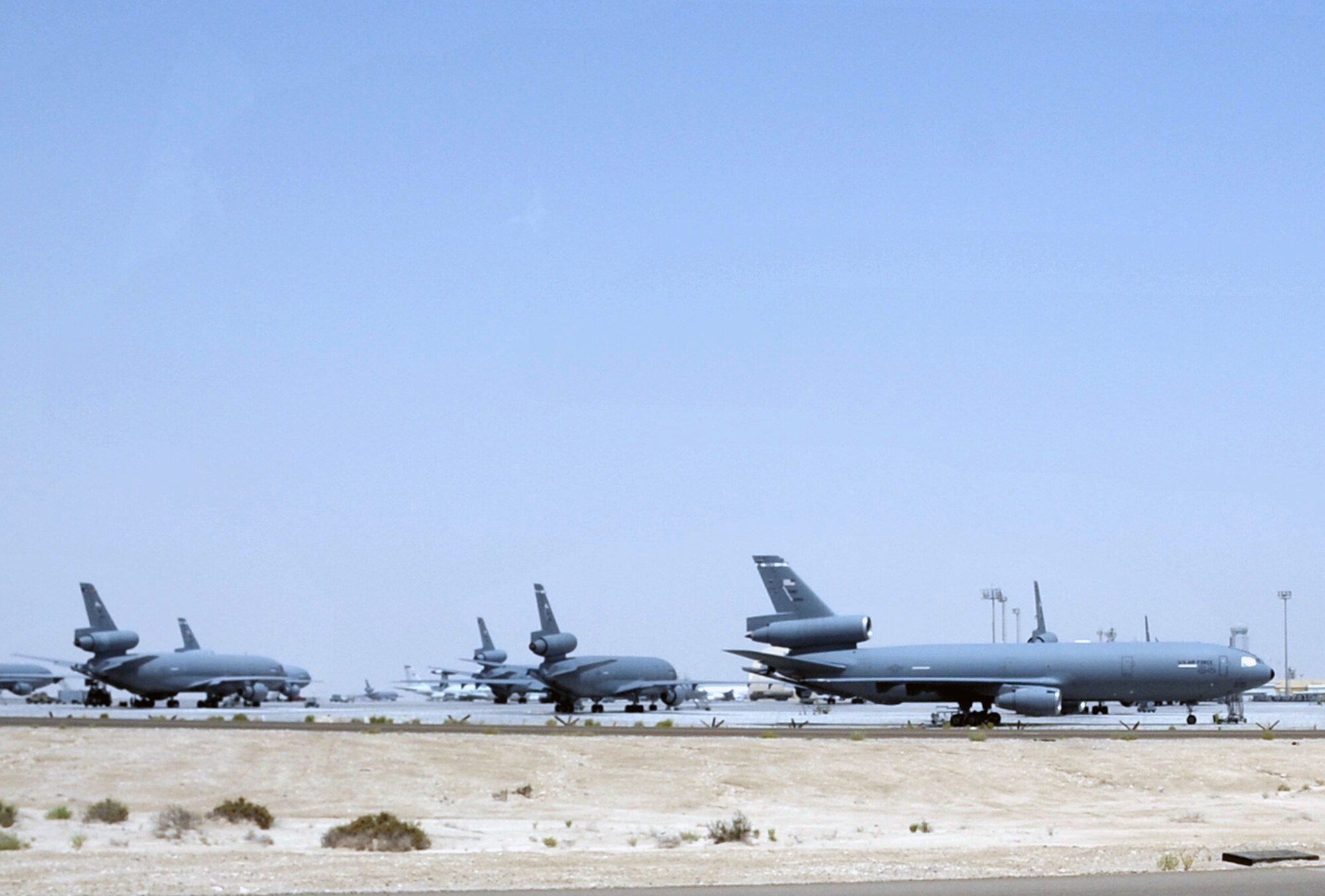 KC-10 Extenders assigned to the 908th Expeditionary Air Refueling Squadron are parked on the flightline for the 380th Air Expeditionary Wing at a non-disclosed base in Southwest Asia on May 19, 2010. KC-10s and the Airmen who support and fly them are deployed from the 305th Air Mobility Wing at Joint Base McGuire-Dix-Lakehurst, N.J., and the 60th Air Mobility Wing at Travis Air Force Base, Calif. The 380th AEW supports operations Iraqi Freedom, Enduring Freedom and the Combined Joint Task Force-Horn of Africa. (U.S. Air Force Photo/Master Sgt. Scott T. Sturkol/Released)