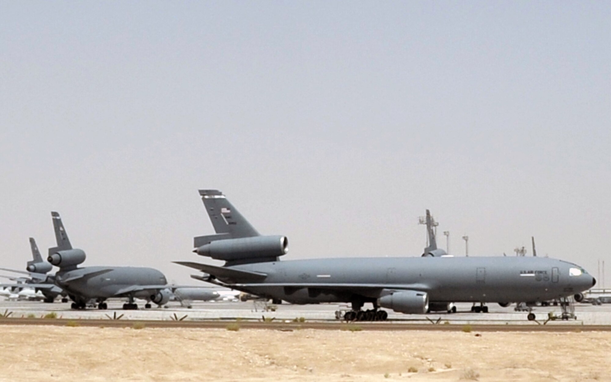 KC-10 Extenders assigned to the 908th Expeditionary Air Refueling Squadron are parked on the flightline for the 380th Air Expeditionary Wing at a non-disclosed base in Southwest Asia on May 19, 2010. KC-10s and the Airmen who support and fly them are deployed from the 305th Air Mobility Wing at Joint Base McGuire-Dix-Lakehurst, N.J., and the 60th Air Mobility Wing at Travis Air Force Base, Calif. The 380th AEW supports operations Iraqi Freedom, Enduring Freedom and the Combined Joint Task Force-Horn of Africa. (U.S. Air Force Photo/Master Sgt. Scott T. Sturkol/Released)