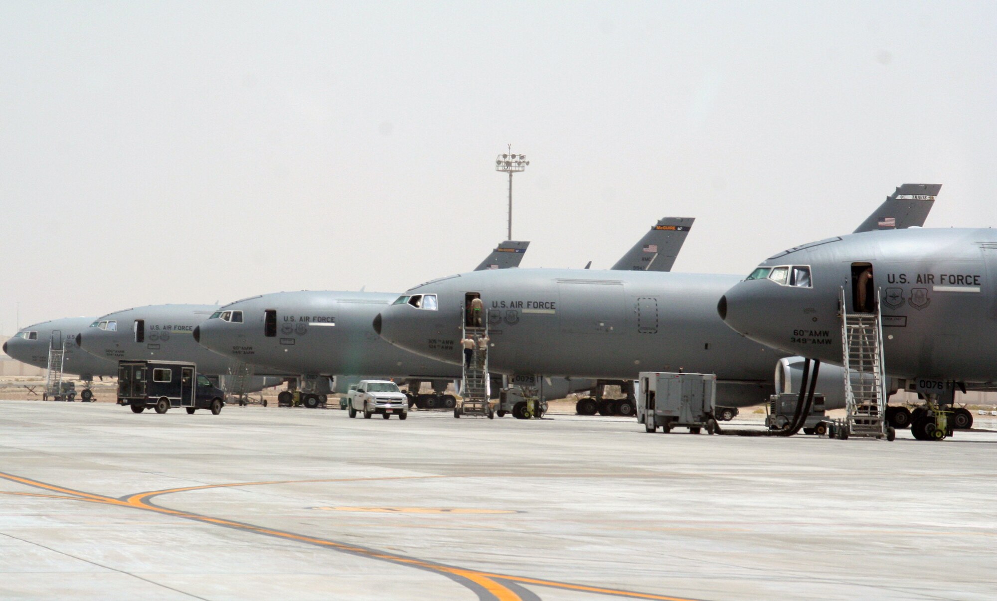 KC-10 Extenders assigned to the 908th Expeditionary Air Refueling Squadron are parked on the flightline for the 380th Air Expeditionary Wing at a non-disclosed base in Southwest Asia on May 19, 2010. KC-10s and the Airmen who support and fly them are deployed from the 305th Air Mobility Wing at Joint Base McGuire-Dix-Lakehurst, N.J., and the 60th Air Mobility Wing at Travis Air Force Base, Calif. The 380th AEW supports operations Iraqi Freedom, Enduring Freedom and the Combined Joint Task Force-Horn of Africa. (U.S. Air Force Photo/Master Sgt. Scott T. Sturkol/Released)