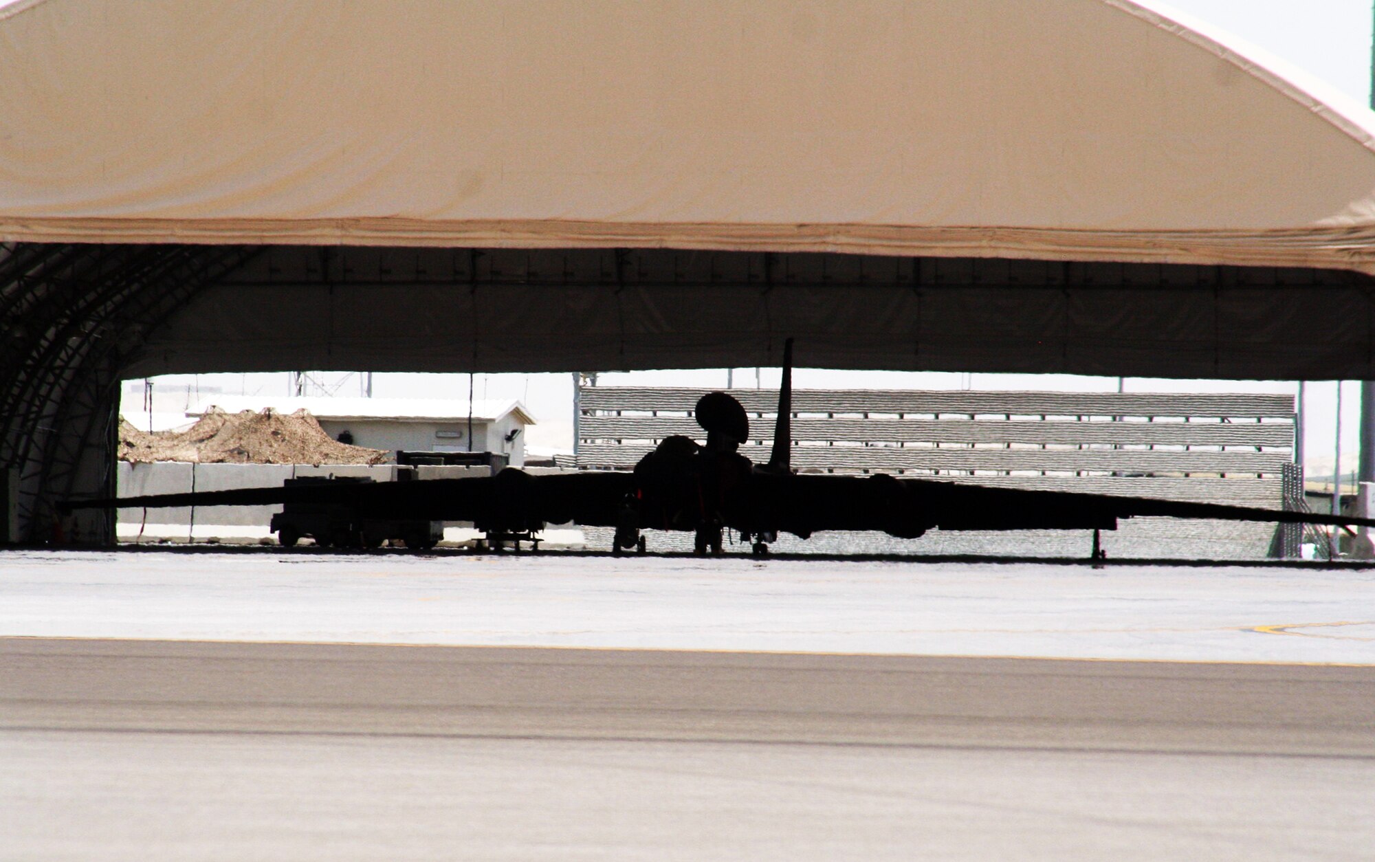 A U-2 Dragon Lady assigned to the 99th Expeditionary Reconnaissance Squadron is parked in a hangar for the 380th Air Expeditionary Wing at a non-disclosed base in Southwest Asia on May 19, 2010. The 99th ERS, as part of the 380th AEW, supports operations Iraqi Freedom, Enduring Freedom and the Combined Joint Task Force-Horn of Africa. (U.S. Air Force Photo/Master Sgt. Scott T. Sturkol/Released)