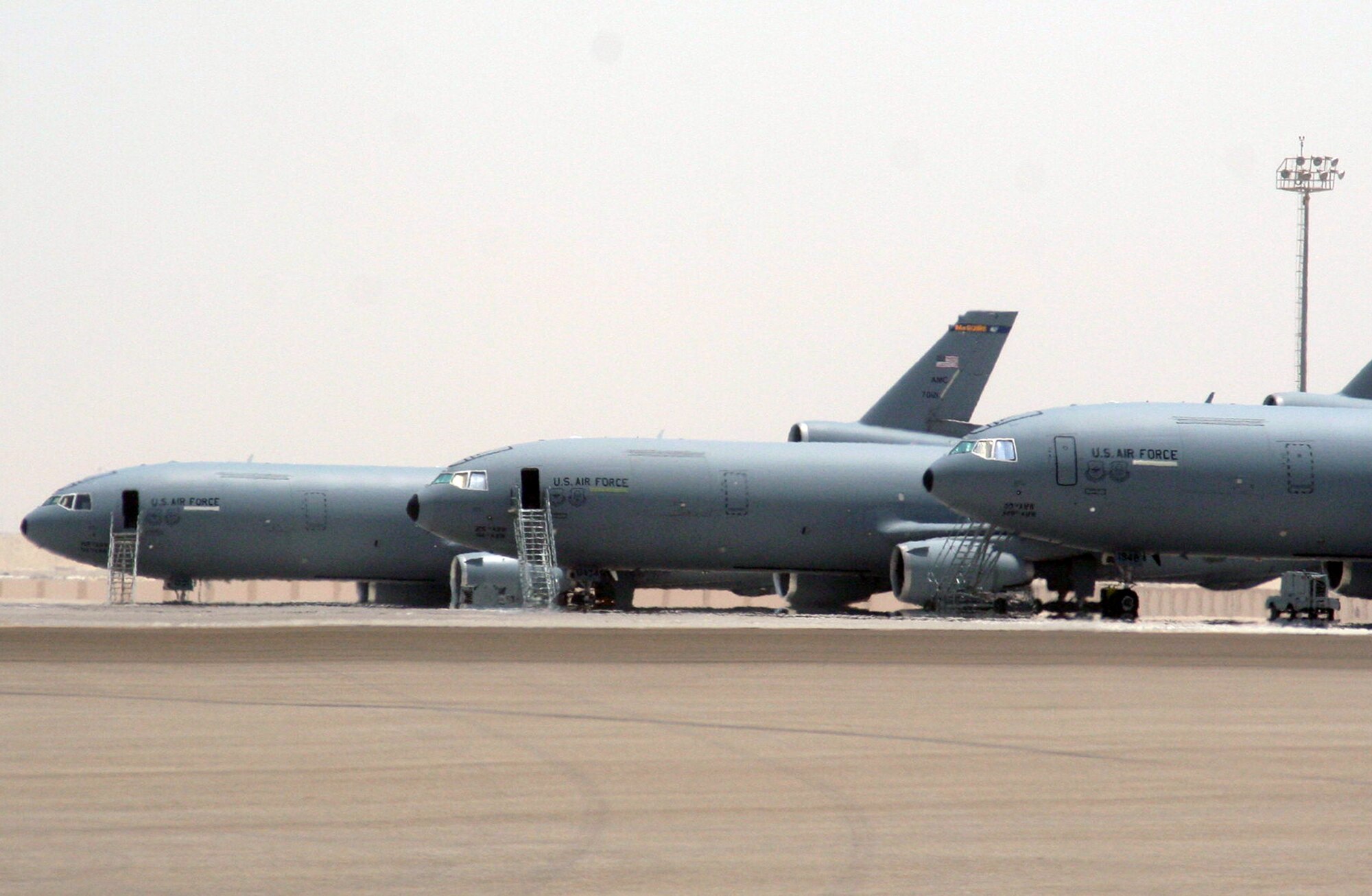 KC-10 Extenders assigned to the 908th Expeditionary Air Refueling Squadron are parked on the flightline for the 380th Air Expeditionary Wing at a non-disclosed base in Southwest Asia on May 19, 2010. KC-10s and the Airmen who support and fly them are deployed from the 305th Air Mobility Wing at Joint Base McGuire-Dix-Lakehurst, N.J., and the 60th Air Mobility Wing at Travis Air Force Base, Calif. The 380th AEW supports operations Iraqi Freedom, Enduring Freedom and the Combined Joint Task Force-Horn of Africa. (U.S. Air Force Photo/Master Sgt. Scott T. Sturkol/Released)