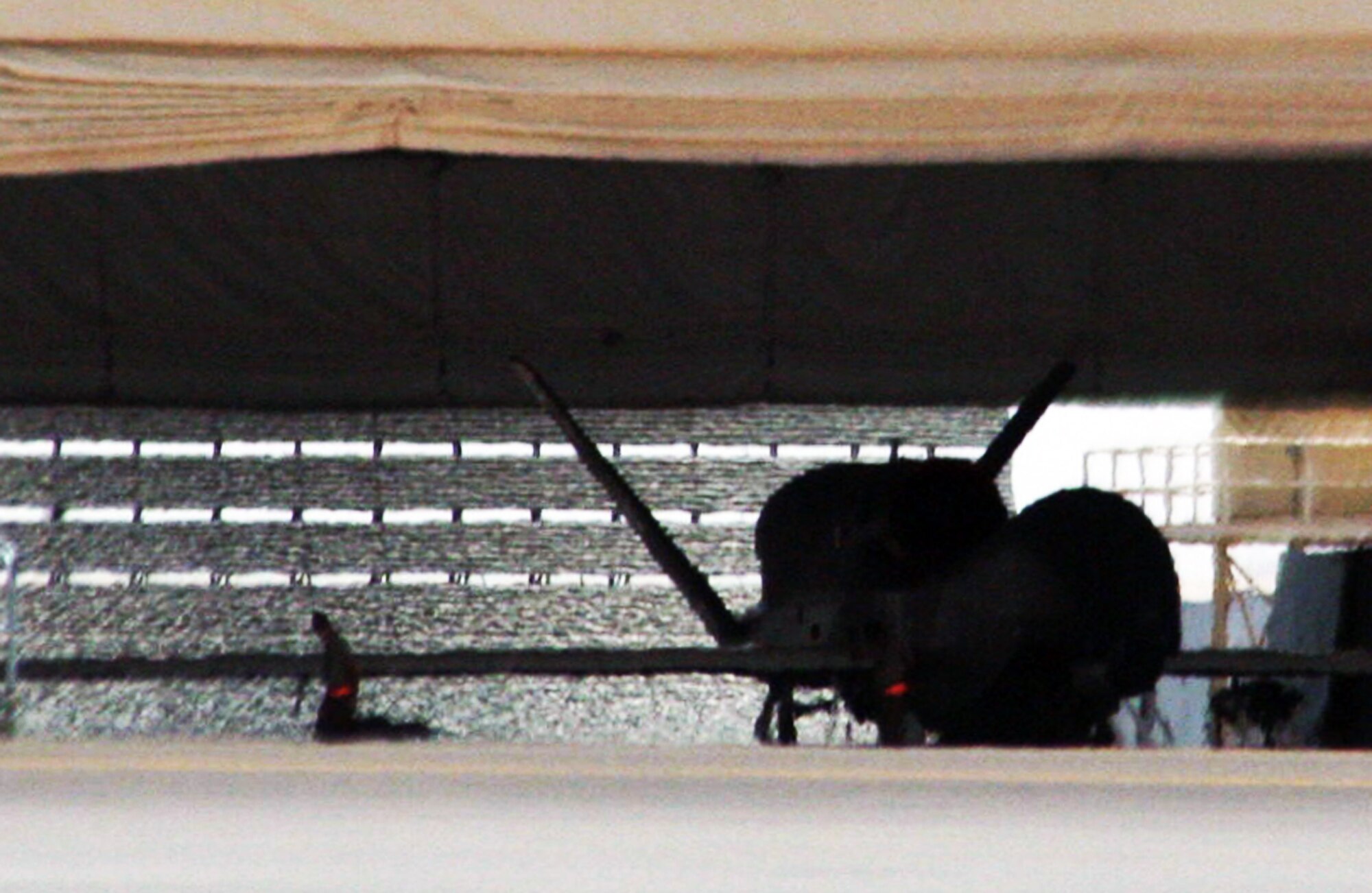 Maintenance Airmen from the 380th Expeditionary Aircraft Maintenance Squadron Hawk aircraft maintenance unit work on an RQ-4 Global Hawk during operations for the 380th Air Expeditionary Wing at a non-disclosed base in Southwest Asia on May 19, 2010. The RQ-4 is one of four airframes assigned to the 380th AEW which supports operations Iraqi Freedom, Enduring Freedom and the Combined Joint Task Force-Horn of Africa. (U.S. Air Force Photo/Master Sgt. Scott T. Sturkol/Released)