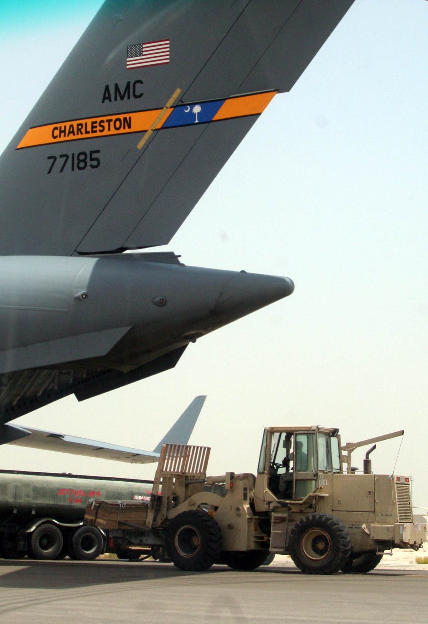 Air transportation Airmen from the 380th Expeditionary Logistics Readiness Squadron's Air Terminal Operations Center work on the flightline during operations for the 380th Air Expeditionary Wing at a non-disclosed base in Southwest Asia on  May 19, 2010. The 380th AEW supports operations Iraqi Freedom and Enduring Freedom and the Combined Joint Task Force-Horn of Africa. All air transportation Airmen deployed with the 380th AEW are deployed from the 89th Aerial Port Squadron at Joint Base Andrews, Md. (U.S. Air Force Photo/Master Sgt. Scott T. Sturkol/Released)