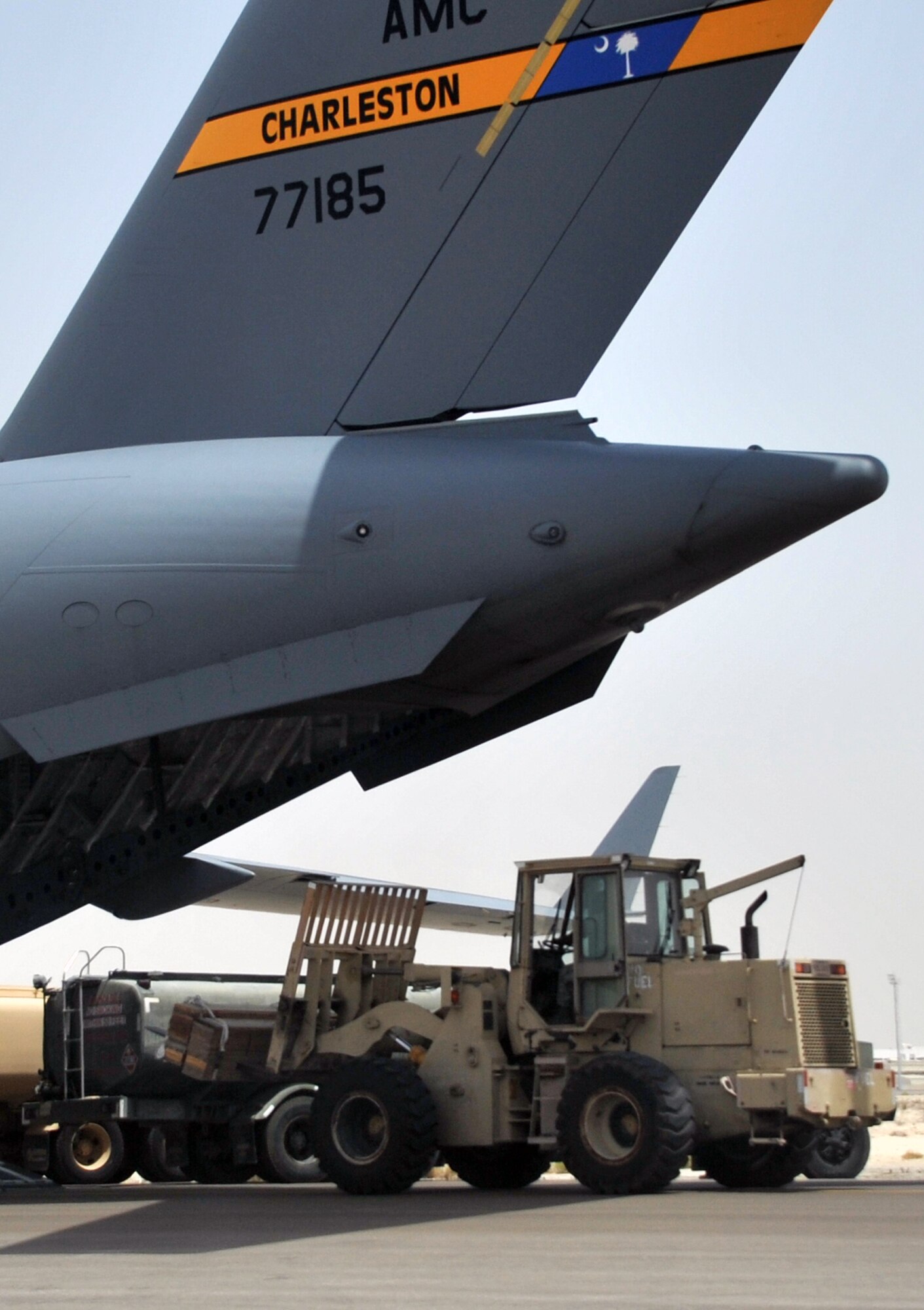 Air transportation Airmen from the 380th Expeditionary Logistics Readiness Squadron's Air Terminal Operations Center work on the flightline during operations for the 380th Air Expeditionary Wing at a non-disclosed base in Southwest Asia on  May 19, 2010. The 380th AEW supports operations Iraqi Freedom and Enduring Freedom and the Combined Joint Task Force-Horn of Africa. All air transportation Airmen deployed with the 380th AEW are deployed from the 89th Aerial Port Squadron at Joint Base Andrews, Md. (U.S. Air Force Photo/Master Sgt. Scott T. Sturkol/Released)