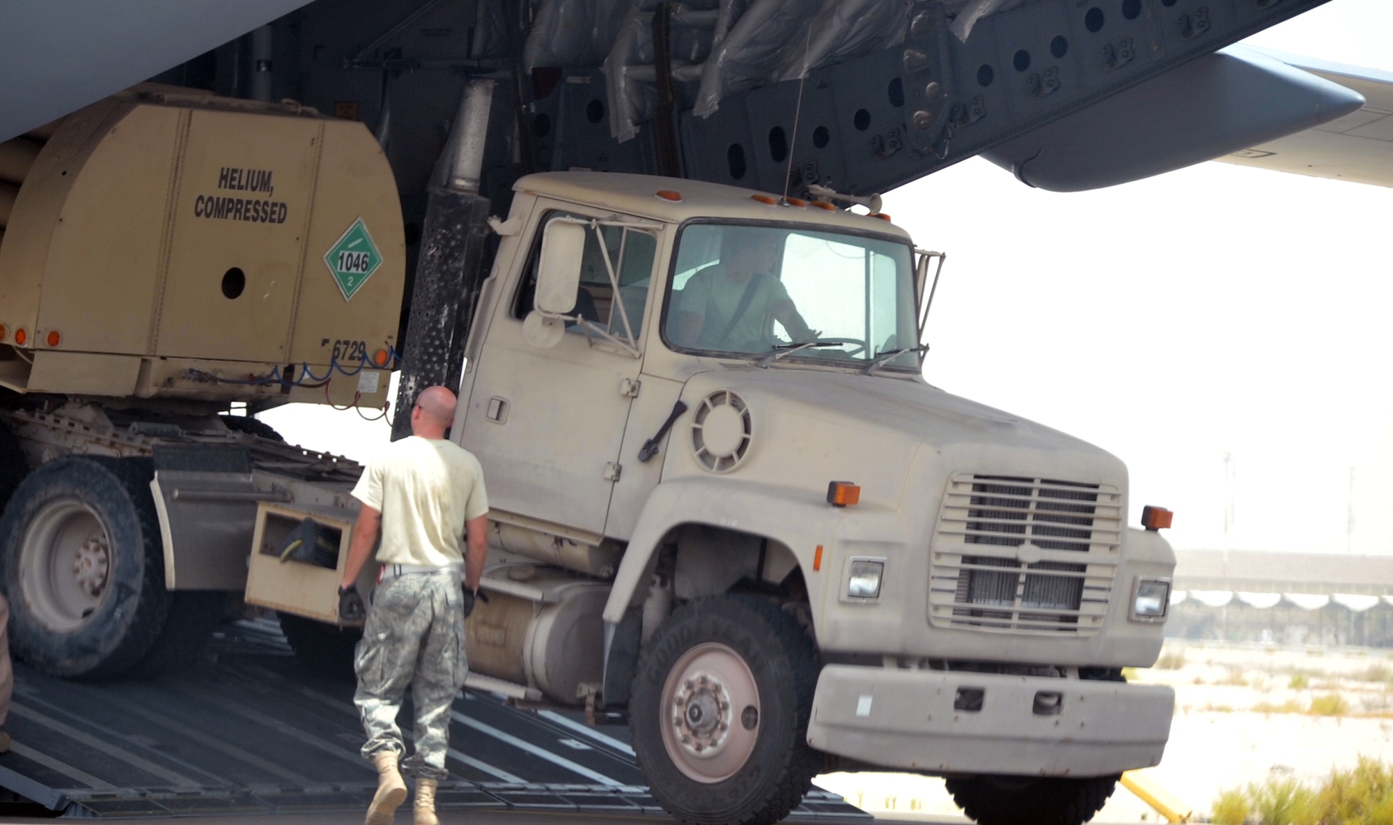 Air transportation Airmen from the 380th Expeditionary Logistics Readiness Squadron's Air Terminal Operations Center work on the flightline during operations for the 380th Air Expeditionary Wing at a non-disclosed base in Southwest Asia on  May 19, 2010. The 380th AEW supports operations Iraqi Freedom and Enduring Freedom and the Combined Joint Task Force-Horn of Africa. All air transportation Airmen deployed with the 380th AEW are deployed from the 89th Aerial Port Squadron at Joint Base Andrews, Md. (U.S. Air Force Photo/Master Sgt. Scott T. Sturkol/Released)