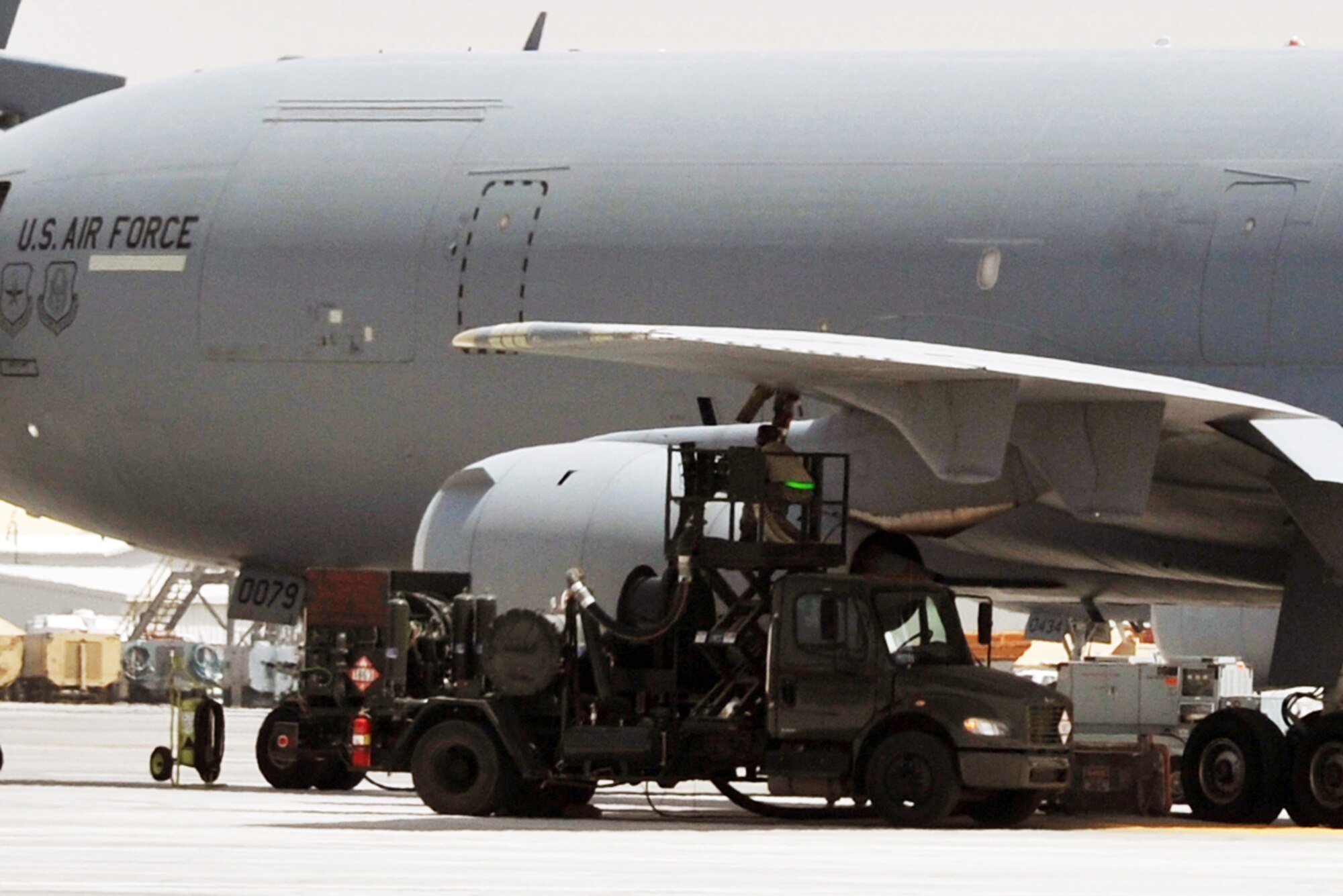 Fuels distribution Airmen from the 380th Expediitonary Logistics Readiness Squadron fuels management flight use an R-12 fuels truck to refuel a KC-10 Extender from the 908th Expeditionary Air Refueling Squadron during flightline operations for the 380th Air Expeditionary Wing at a non-disclosed base in Southwest Asia in May 19, 2010. The 380th AEW supports operations Iraqi Freedom, Enduring Freedom and the Combined Joint Task Force-Horn of Africa. (U.S. Air Force Photo/Master Sgt. Scott T. Sturkol/Released)