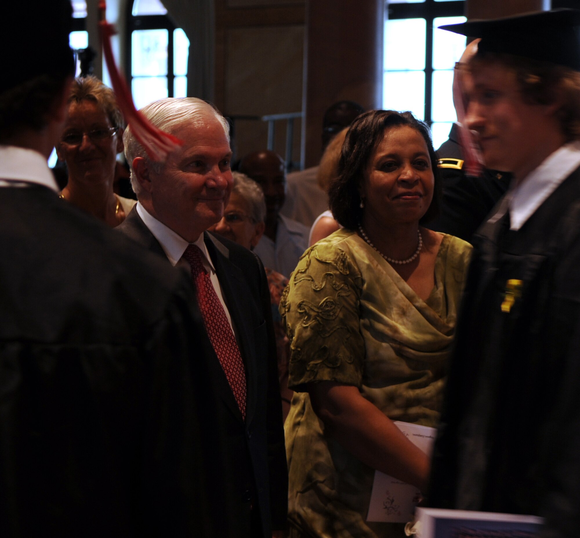 Secretary of Defense Robert M. Gates watches newly graduated students pass by at the Kaiserslautern High School graduation ceremony Kaiserslautern, Germany, June 11, 2010.  Secretary Gates accepted the student body's invitation to be the commencement speaker, honoring the many graduates that are also military dependents. (U.S. Air Force photo by Airman 1st Class Caleb Pierce)