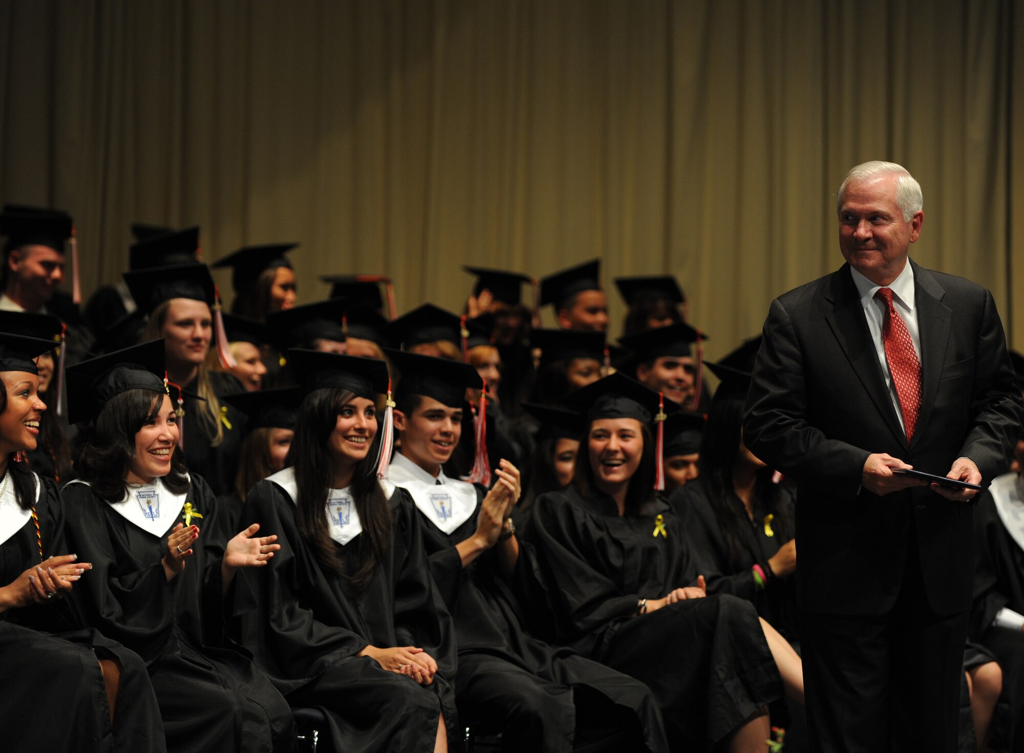 Secretary of Defense Robert M. Gates presents graduates their diplomas at the Kaiserslautern High School graduation ceremony Kaiserslautern, Germany, June 11, 2010.  Secretary Gates accepted the student body's invitation to be the commencement speaker, honoring the many graduates that are also military dependents. (U.S. Air Force photo by Airman 1st Class Caleb Pierce)
