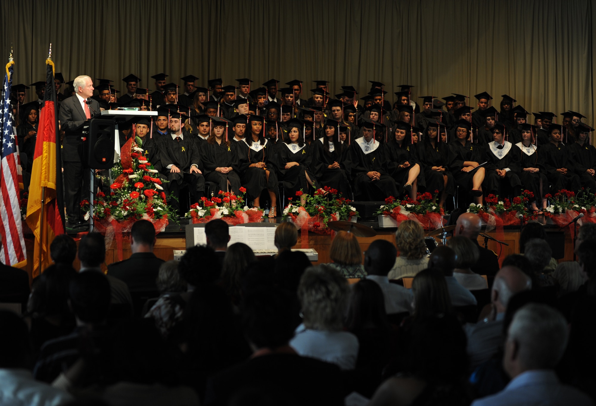 Secretary of Defense Robert M. Gates addresses attendees at the Kaiserslautern High School graduation ceremony, Kaiserslautern, Germany, June 11, 2010.  Secretary Gates accepted the student body's invitation to be the commencement speaker, honoring the many graduates that are also military dependents. (U.S. Air Force photo by Airman 1st Class Caleb Pierce)