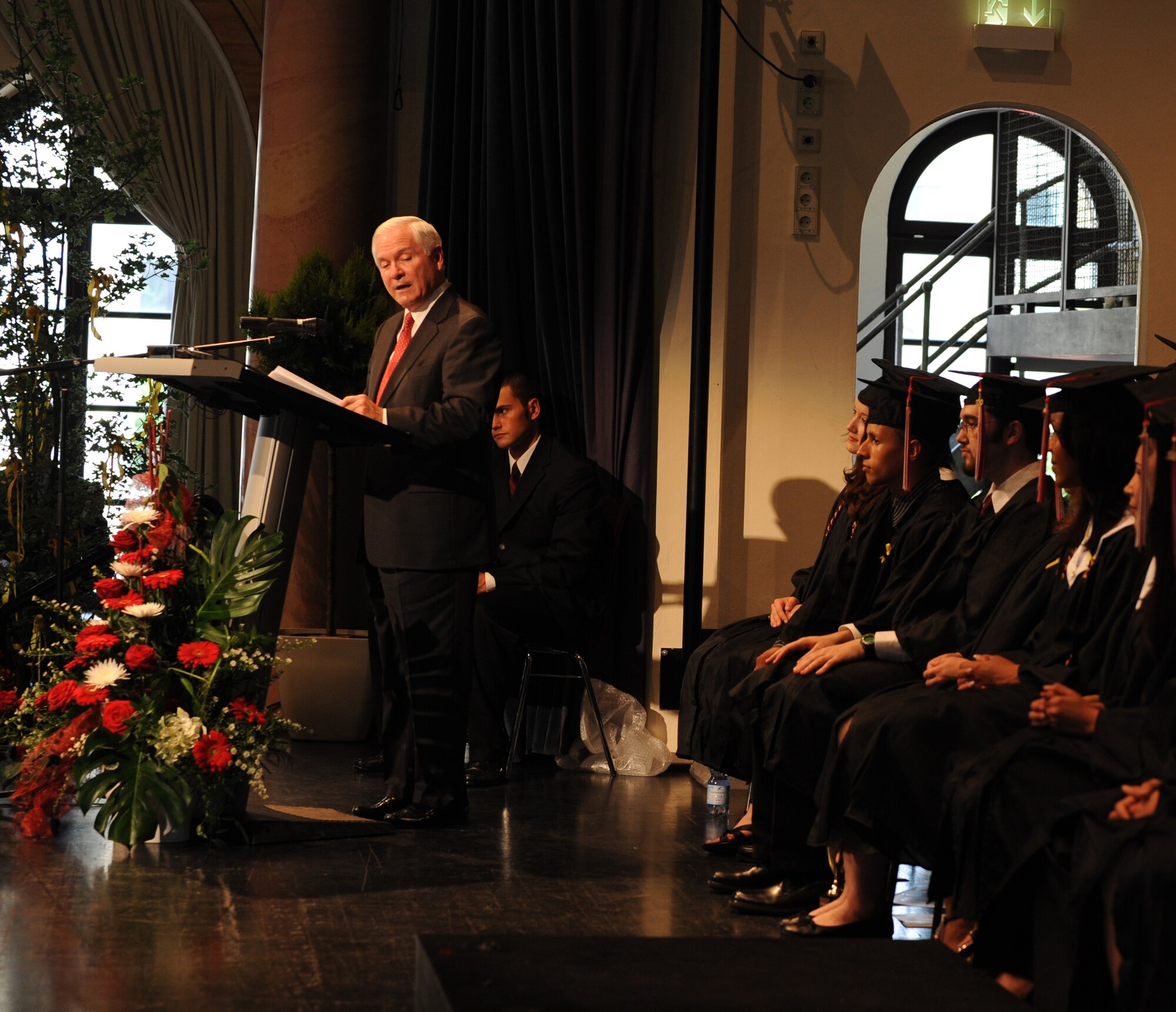 Secretary of Defense Robert M. Gates addresses attendees at the Kaiserslautern High School graduation ceremony, Kaiserslautern, Germany, June 11, 2010.  Secretary Gates accepted the student body's invitation to be the commencement speaker, honoring the many graduates that are also military dependents. (U.S. Air Force photo by Airman 1st Class Caleb Pierce)
