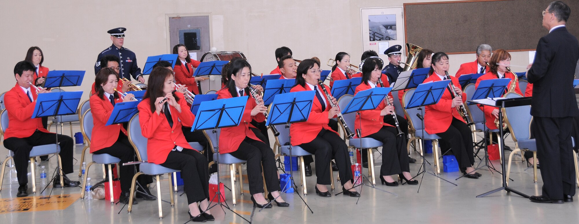 YOKOTA AIR BASE, Japan -- Members of the Mizuho Youth Symphonic Band play music for the 374th Maintenance Squadron Change of Command here, June 11. The Mizuho Youth Symphonic Band has been around since 1969 when Hisatoshi Muta, the band conductor, established the band as a way for students to continue practicing music long after they had graduated school. (U.S. Air Force photo/Airman 1st Class Lynsie Lorenz)