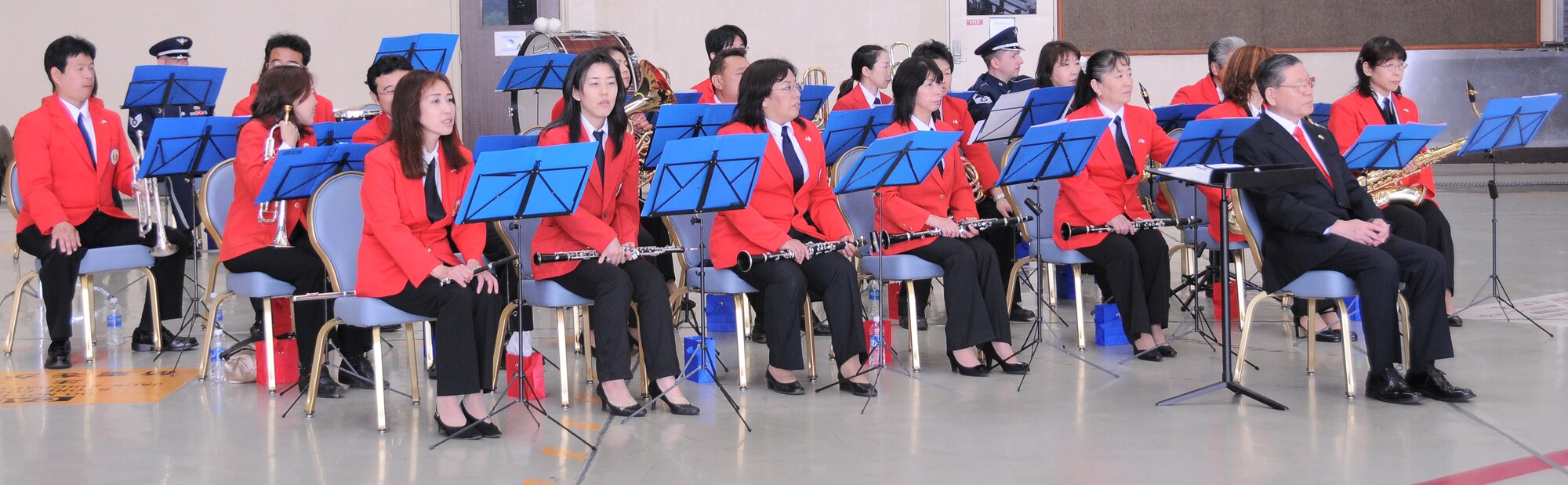 YOKOTA AIR BASE, Japan -- Members of the Mizuho Youth Symphonic Band patiently wait for their cue to start playing. The Mizuho Youth Symphonic Band has been around since 1969 when Hisatoshi Muta, the band conductor, established the band as a way for students to continue practicing music long after they had graduated school. (U.S. Air Force photo/ Airman 1st Class Lynsie Lorenz)