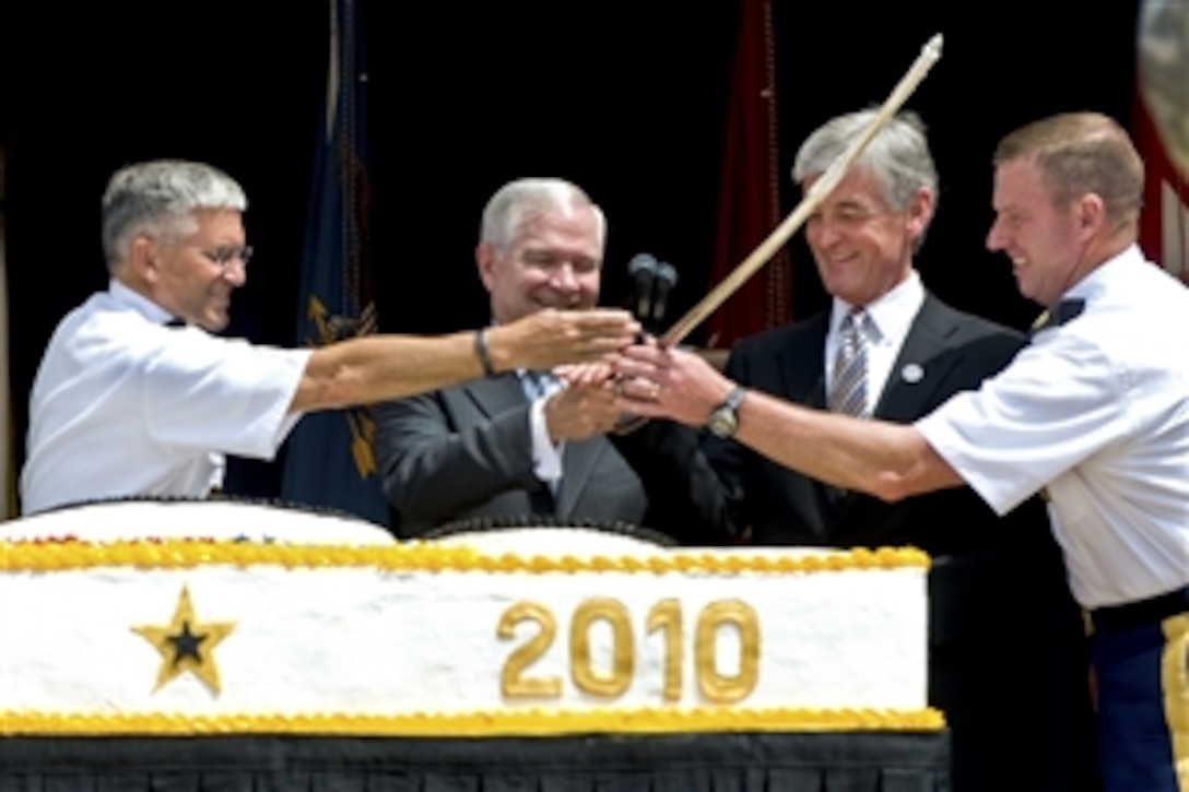 From left to right, Army Chief of Staff Gen. George W. Casey Jr., Defense Secretary Robert M. Gates, Army Secretary John M. McHugh and Sgt. Maj. of the Army Kenneth O. Preston pass the sword after they collectively cut the cake for the Army's 235th Birthday celebration in the Pentagon's courtyard, June 14, 2010. The Continental Congress passed a resolution, June 14, 1775, to authorize 10 companies of riflemen.