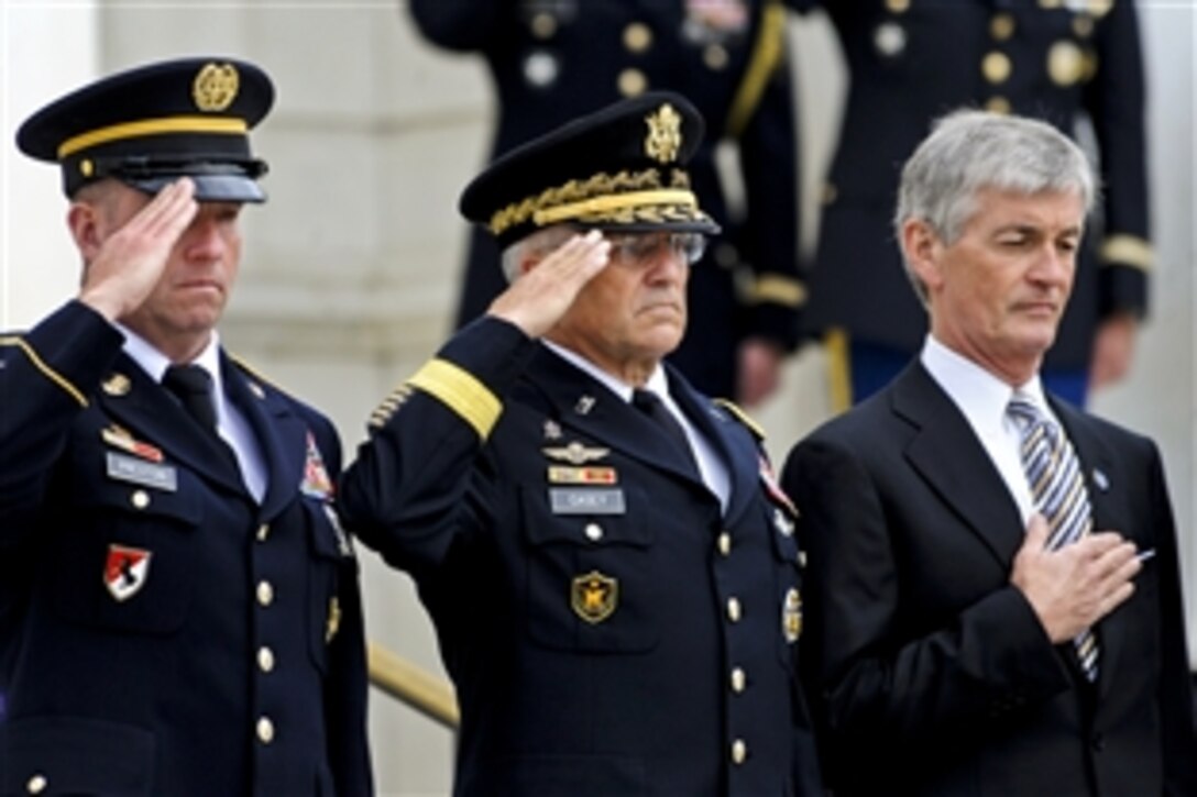 Army Secretary John M. McHugh, right, Army Chief of Staff Gen. George W. Casey Jr., center, and Sgt. Maj. of the Army Kenneth O. Preston render honors after presenting a wreath at the Tomb of the Unknown Soldier in Arlington National Cemetery, Va., June 14, 2010.  
