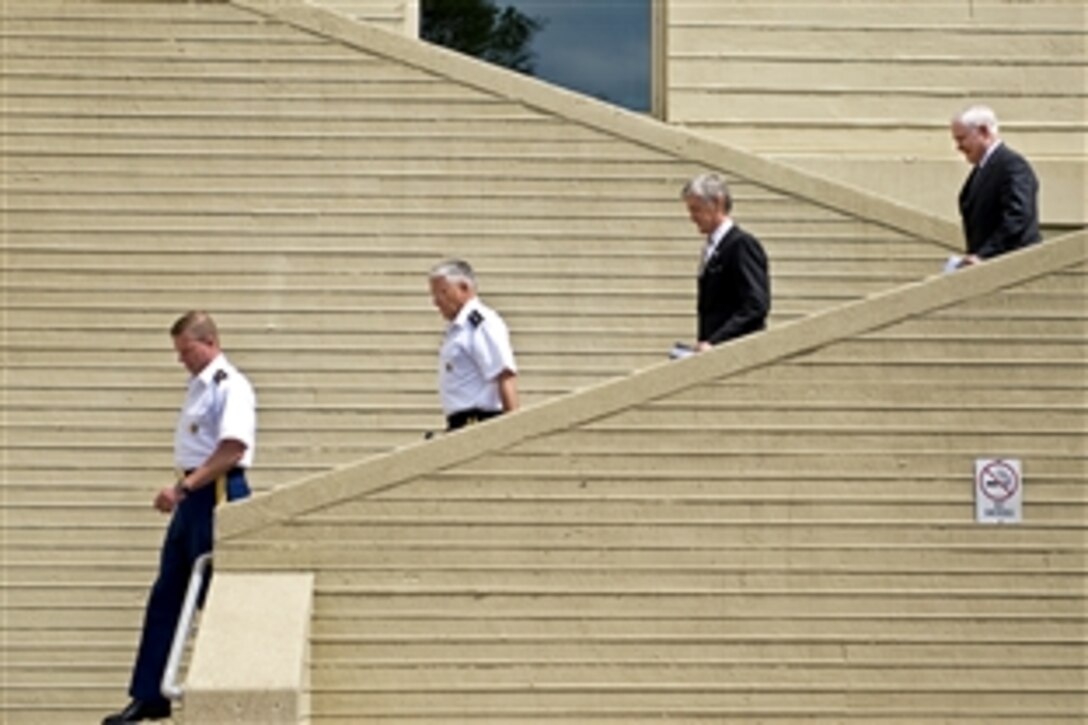 From left to right, Sgt. Maj. of the Army Kenneth O. Preston, Army Chief of Staff Gen. George W. Casey Jr., Army Secretary John M. McHugh and Secretary of Defense Robert M. Gates arrive at the Army's 235th birthday celebration in the Pentagon's courtyard, June 14, 2010.