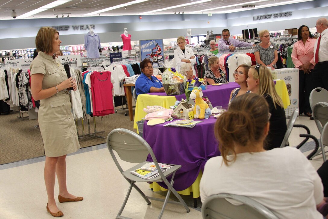 Lindy Seto, a representative of MCCS, speaks to the mothers at the Mothers-to-Bee social a the Marine Corps Exchange June 15 about the “Bright Beginnings” baby care program. The social had seven guest speakers who spoke to the women about programs and services offered by the Combat Center.