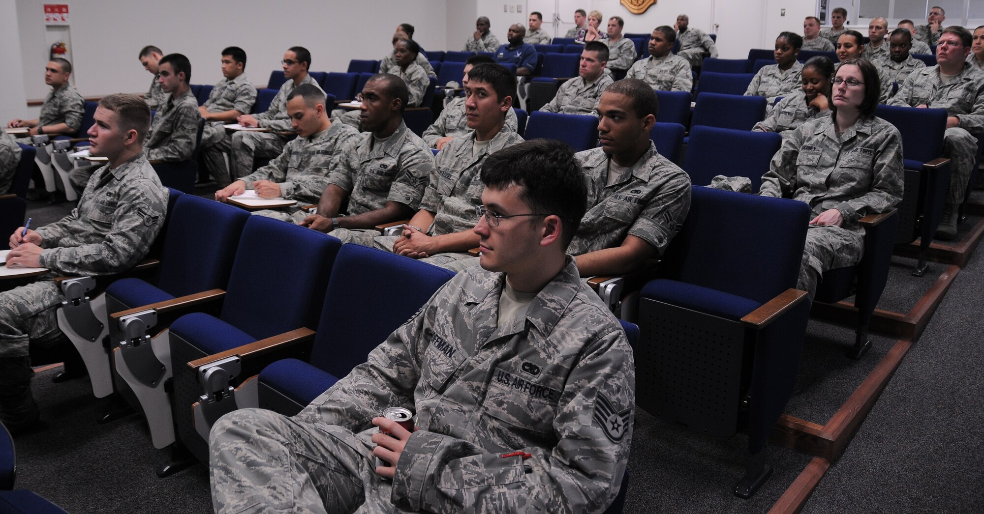 YOKOTA AIR BASE, Japan -- Airmen and supervisors from Team Yokota listen inventively to information about obtaining Below the Zone and making packages that stand out. Below the Zone is a program that allows airmen who qualify, to sew on Senior Airman six months prior to promotion. Below the Zone is statistically the second hardest stripe to earn in the Air Force since only 15 percent of all eligible airmen obtain the stripe six months early. (U.S. Air Force photo/Senior Airman Michael Dillon)