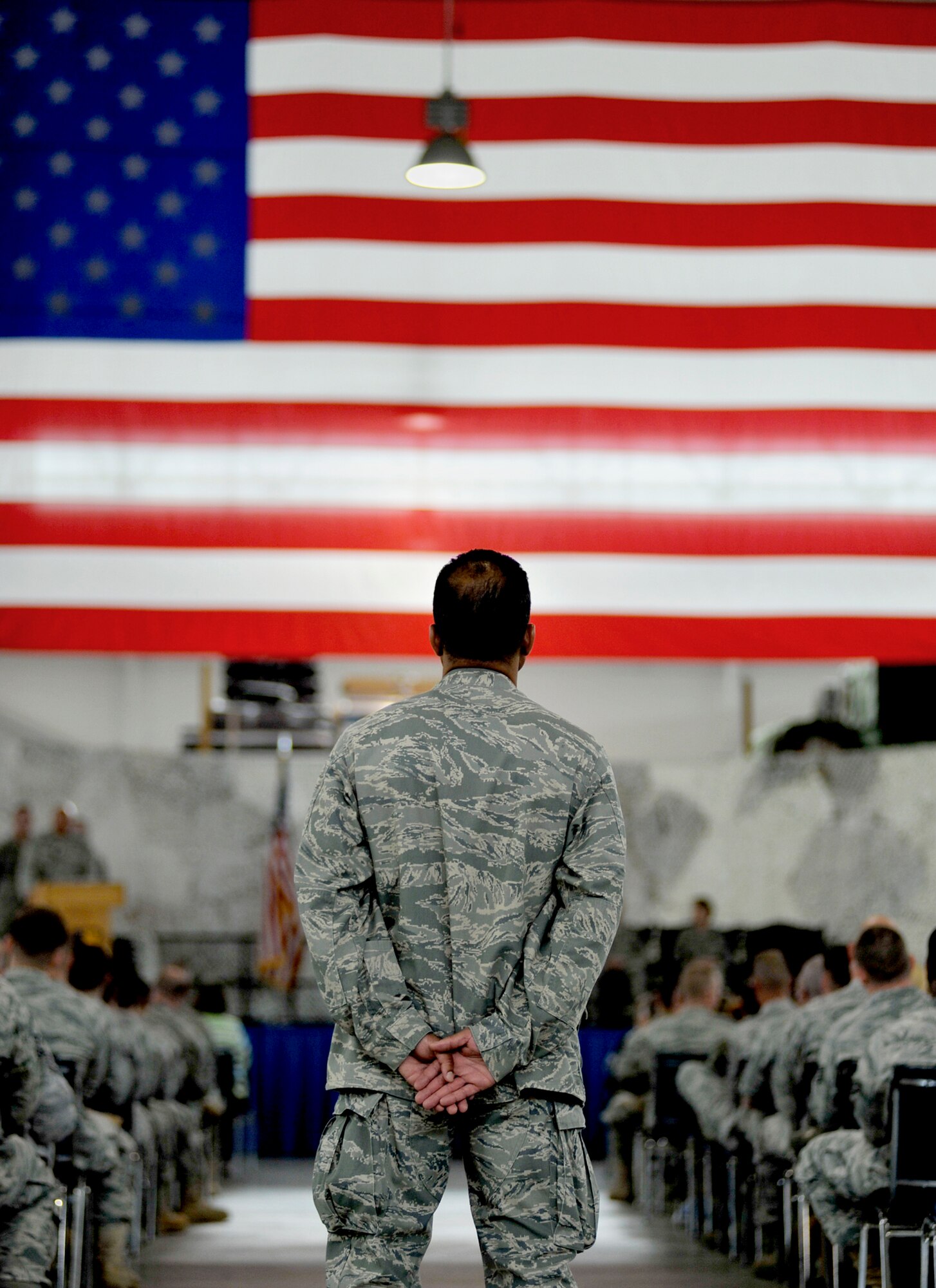 Lt. Col. Tom Highsmith observes the inactivation ceremony of the 816th Contingency Response Group June 11, 2010, at Joint Base McGuire-Dix-Lakehurst, N.J. The inactivation is part of an Air Force ordered restructuring that boosts the capabilities of the wing's remaining groups and assists the creation of an Air National Guard CRG. Colonel Highsmith is the 816th Global Mobility Squadron director of operations. (U.S. Air Force photo/Tech. Sgt. Parker Gyokeres)