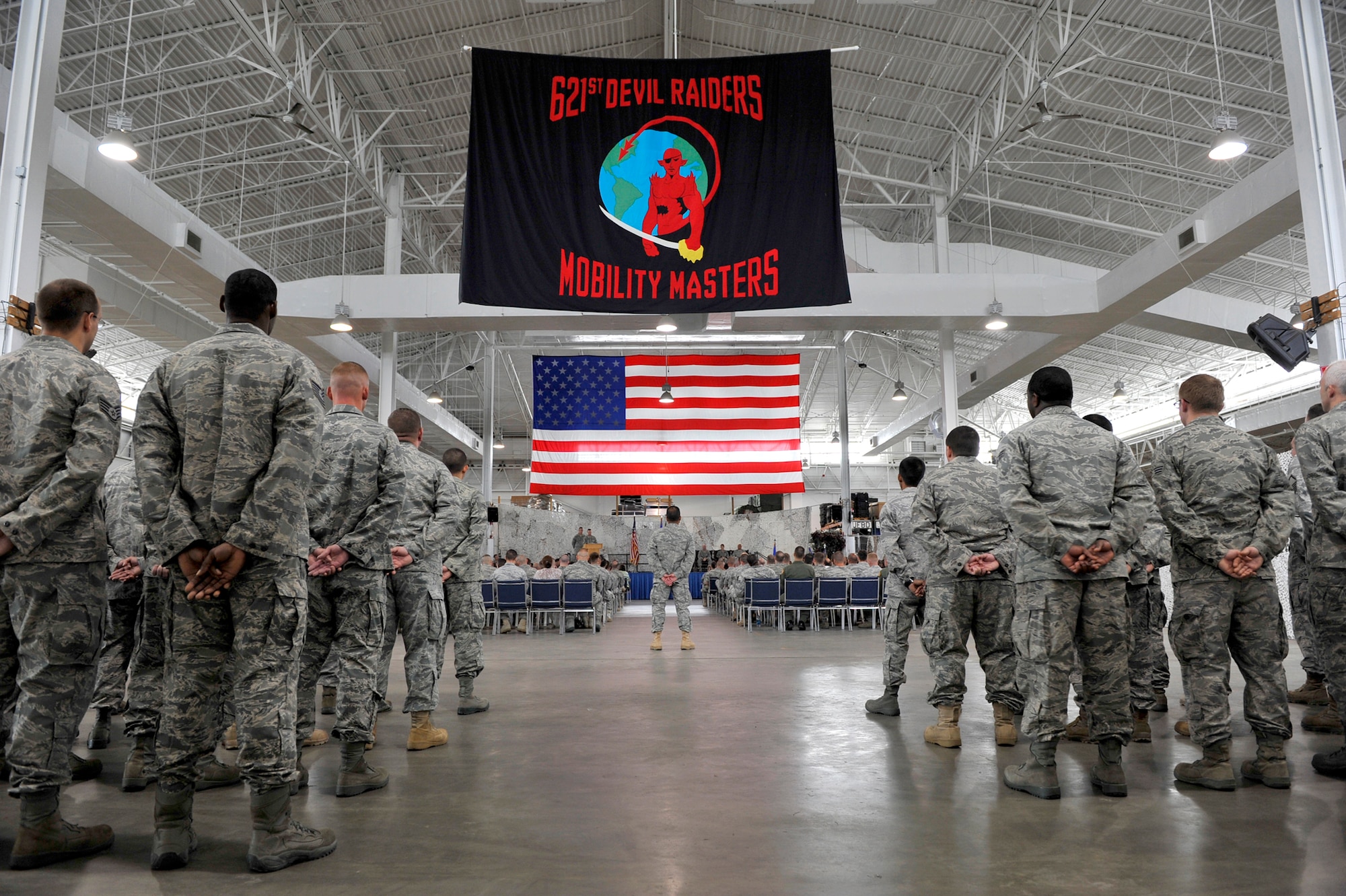 Members of the 816th Contingency Response Group, 621st Contingency Response Wing, observe its inactivation ceremony at the CRW Global Reach Deployment Center June 11, 2010, at Joint Base McGuire-Dix-Lakehurst, N.J. The inactivation is part of an Air Force ordered restructuring that boosts the capabilities of the wing's remaining groups and assists the creation of an Air National Guard CRG. (U.S. Air Force photo/Tech. Sgt. Parker Gyokeres)