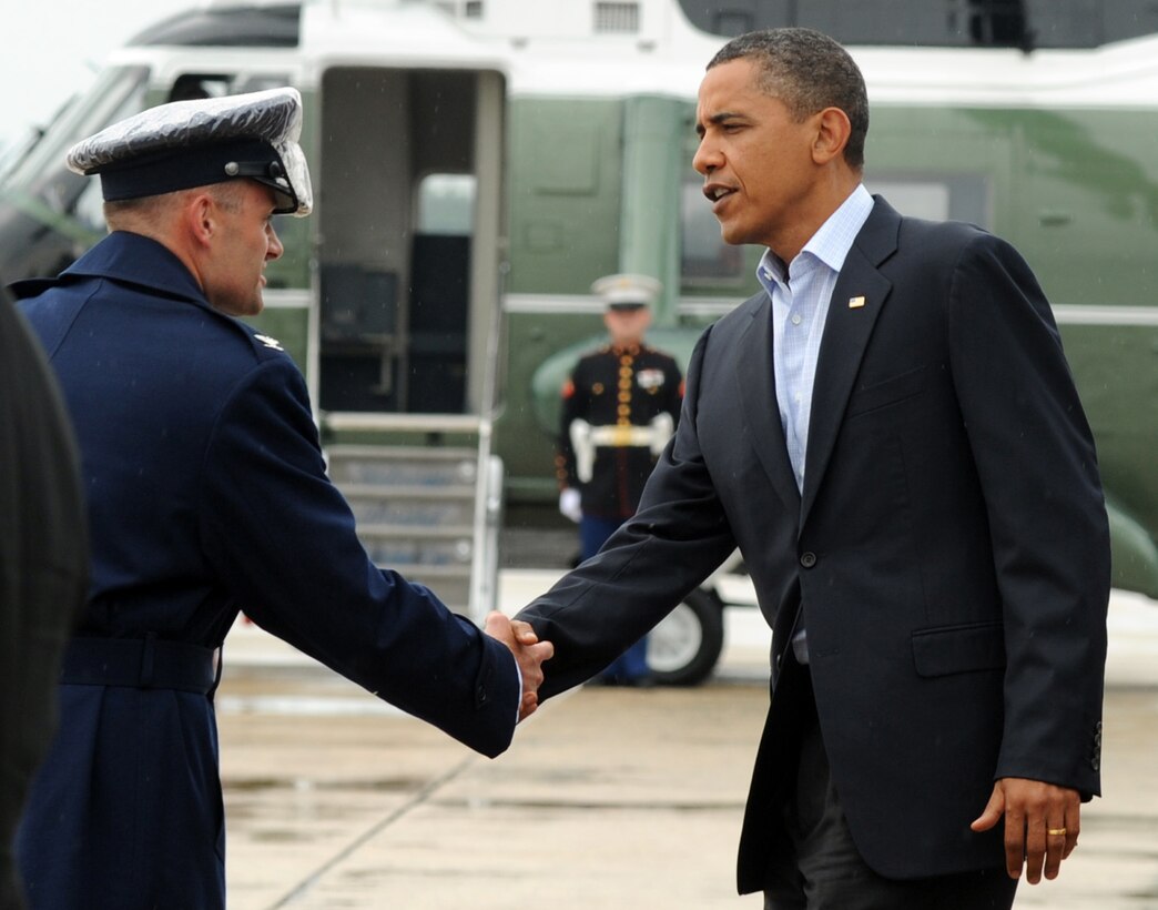 President Barack Obama is greeted by Col. Ken Rizer, 316th Wing commander, on his arrival to Joint Base Andrews, June 15, 2010. President Obama returned from Pensacola, Fla., after his fourth visit to the Gulf Coast since the April 20 oil spill. (U.S. Air Force photo by Senior Airman Melissa V. Brownstein)
