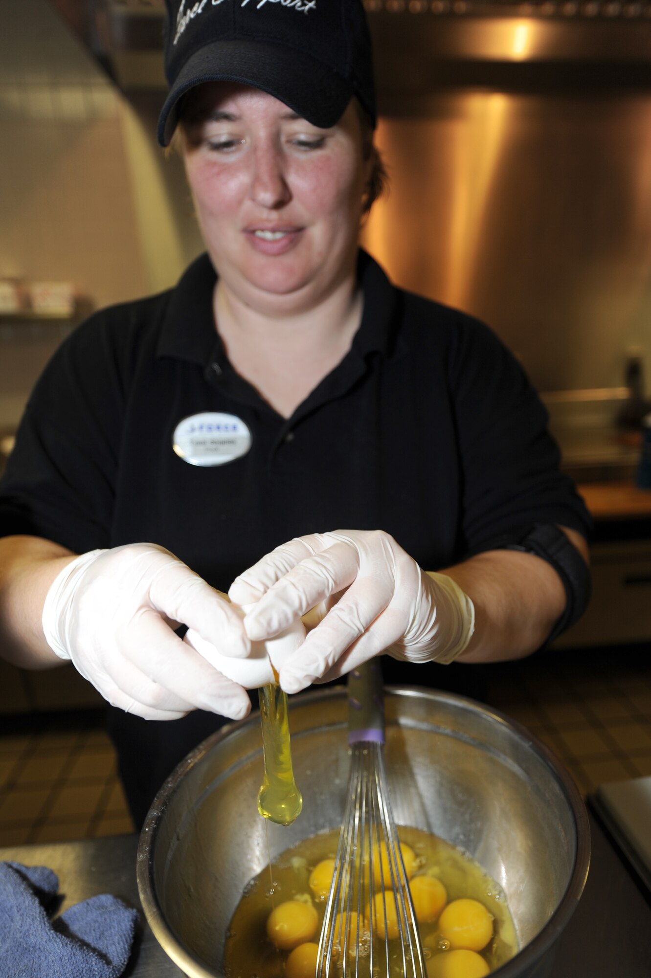 WHITEMAN AIR FORCE BASE, Mo.- Traci Shields, 509th Force Support Squadron bowling center cook, prepares breakfast during the morning rush at the Whiteman Bowling Center, The center averages 70 - 80 customers every morning.(U.S. Air Force photo/Airman 1st Class Carlin Leslie)
 