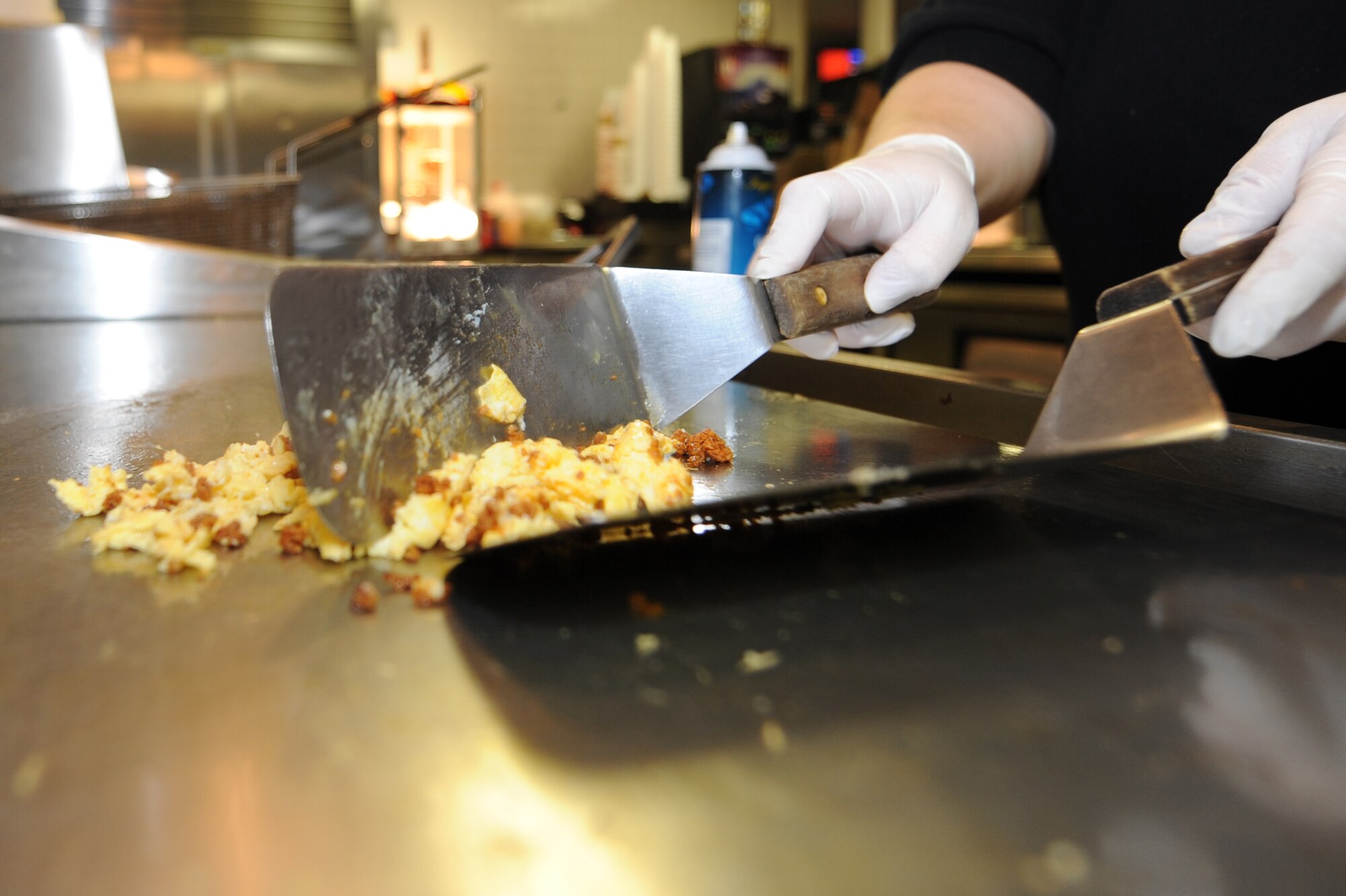 WHITEMAN AIR FORCE BASE, Mo.- Traci Shields, 509th Force Support Squadron bowling center cook, prepares eggs for a burrito during the morning rush at the Whiteman Bowling Center. The center averages 70 - 80 customers every morning.  (U.S. Air Force photo/Airman 1st Class Carlin Leslie)
 