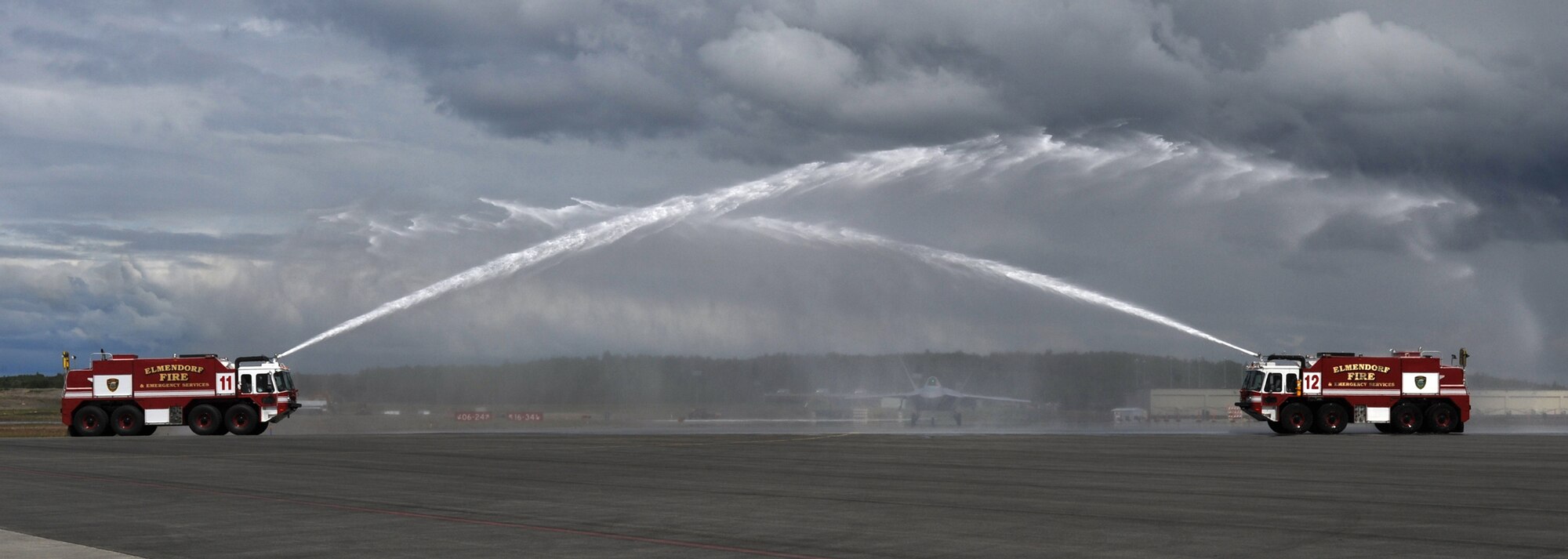 Brig. Gen. Thomas Bergeson taxis in an F-22 Raptor through water for his fini-flight June 10. General Bergeson is the 3rd Wing commander. (Air Force photo by Senior Airman Cynthia Spalding)