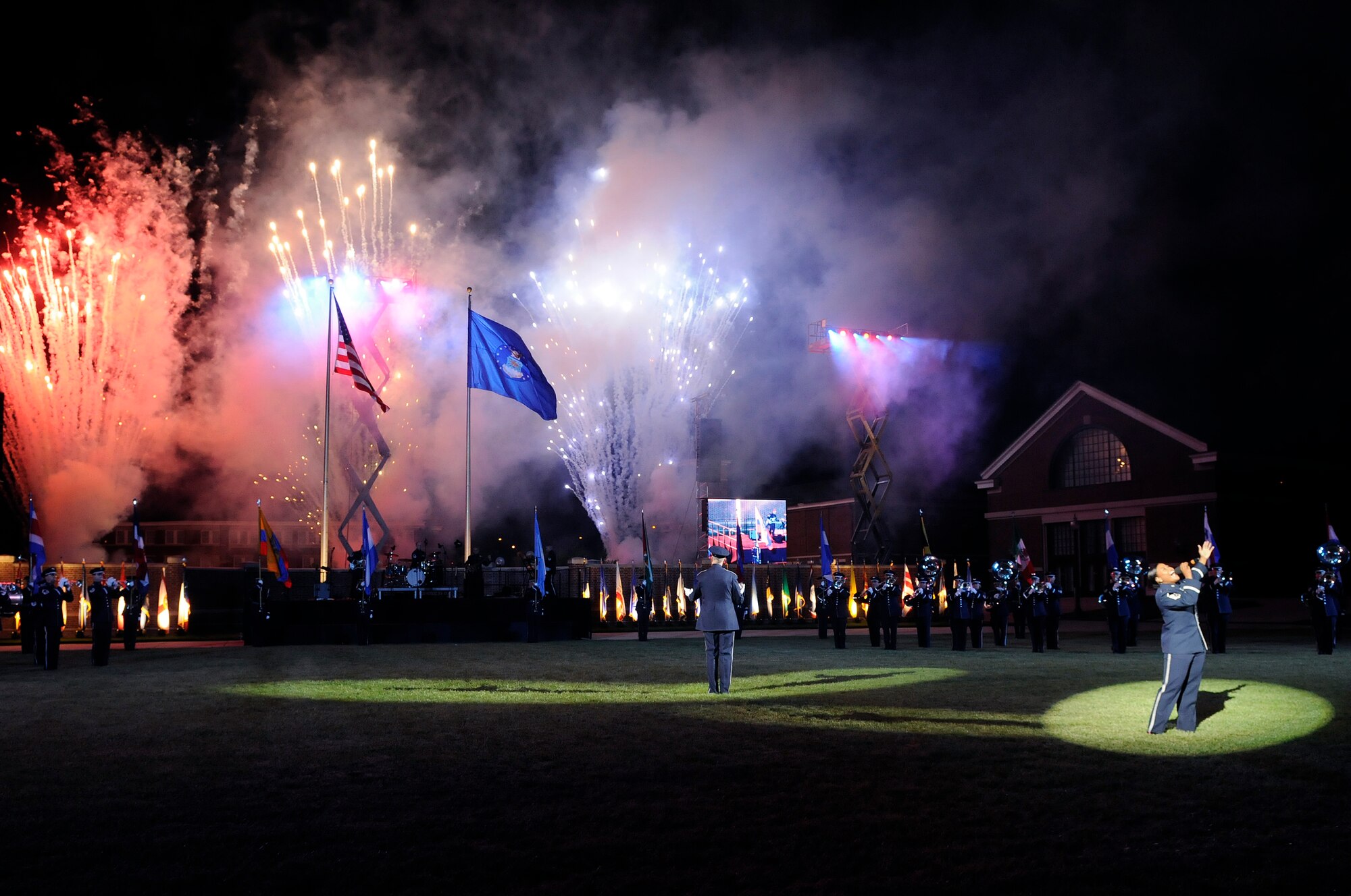 The United States Air Force Honor Guard and Band perform during the Conference of American Air Chiefs Twilight Tattoo June 13 at the U.S. Air Force Ceremonial Lawn on Bolling Air Force Base. Gen. Norton A. Schwartz, U.S. Air Force chief of staff, hosted the event celebrating "50 Years of Friendship and Cooperation" between nations belonging to the System of Cooperation among American Air Forces. (U.S. Air Force photo by Senior Airman Jaclyn McDonald)