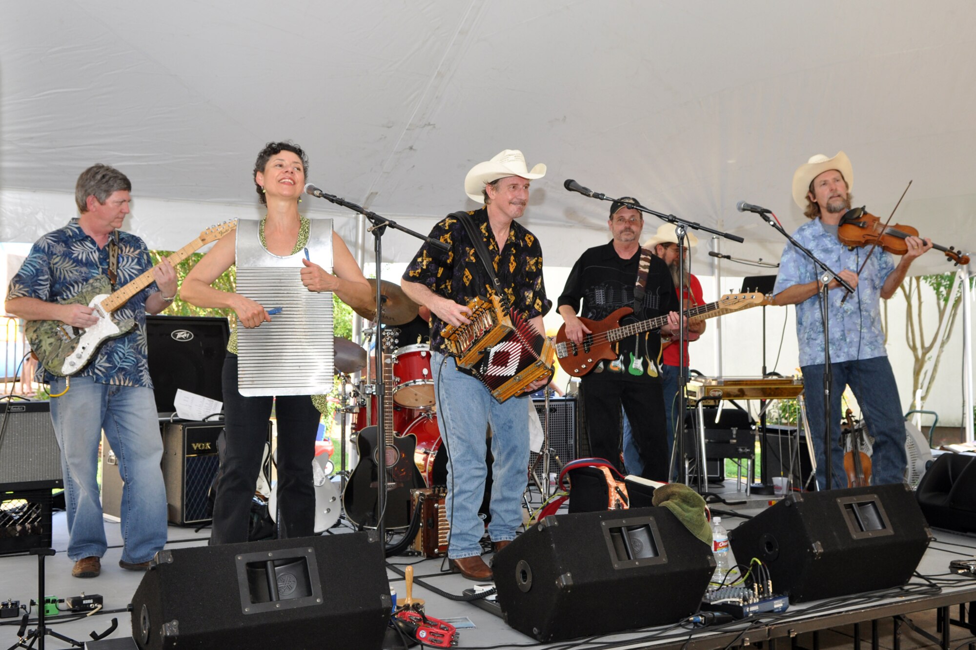The Red River Playboys entertain the crowd at the Barksdale Crawfish Festival on Barksdale Air Force Base, La., June 11, 2010. The band performed Zydeco music for hundreds of people attending the “blow off some steam” event, which featured crawfish dinners, corndogs for the kiddies, as well as crawfish eating contests and a drawing for prizes. (U.S. Air Force photo/Tech. Sgt. Jeff Walston)

