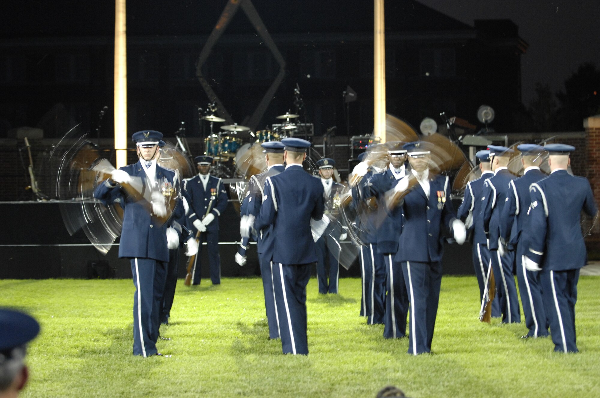 The United States Air Force Honor Guard Drill Team performs during the Conference of American Air Chiefs Twilight Tattoo June 13 at the U.S. Air Force Ceremonial Lawn on Bolling Air Force Base. Gen. Norton A. Schwartz, U.S. Air Force chief of staff, hosted the event celebrating "50 Years of Friendship and Cooperation" between nations belonging to the System of Cooperation among American Air Forces. (U.S. Air Force photo by Thomas Dennis)