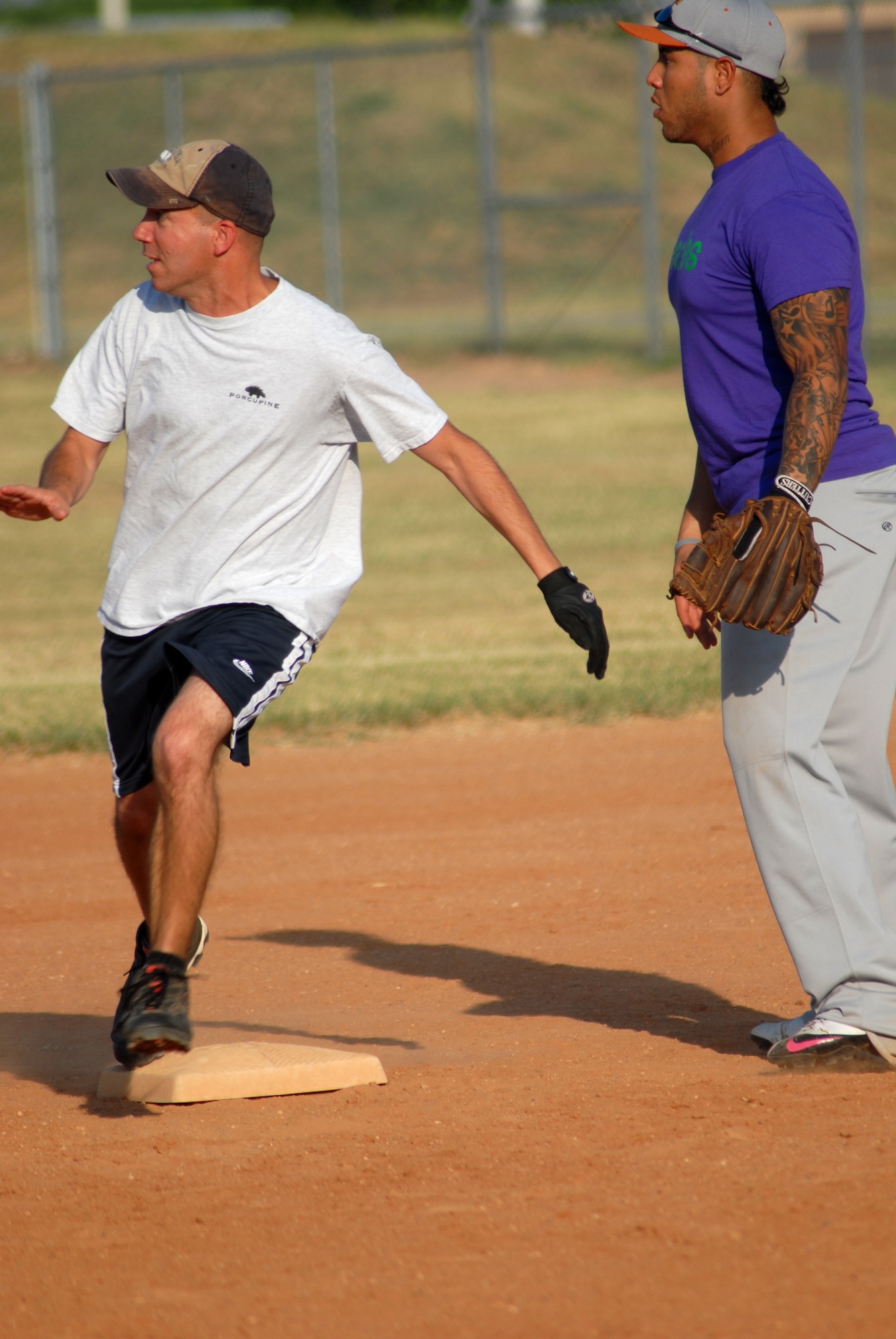 Master Sgt. Brandon O’Neill, a team member for the 17th Mission Support Group Junk Yard Dogs, rounds second on his way to a stand up triple during a game against the 17th Medical Group Cobras.  The Junk yard Dogs went on to defeat the Cobras 16 to 1.