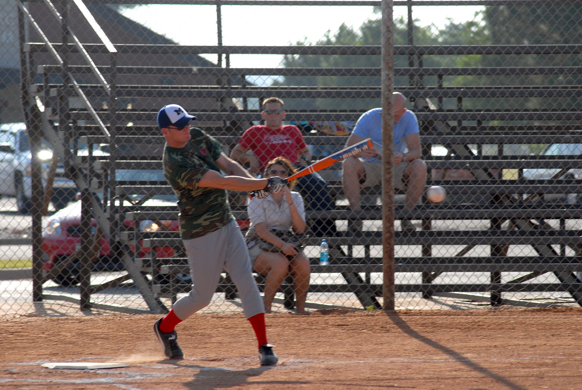Staff Sgt Daniel Matthies, 312th Training Squadron Fire Dawgs, hits a pitch during a game against the Navy/Marines softball team.  The Fire Dawgs went on to defeat the Navy and Marines 26 to 7. (U.S. Air Force photo/Master Sgt Randy Mallard)