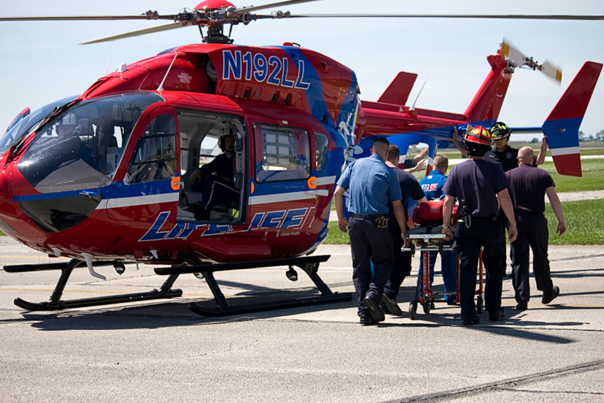 GRISSOM AIR RESERVE BASE, Ind. -- Grissom firefighters and flight nurses from a local medevac helicopter crew practice loading patients into a running helicopter. (U.S. Air Force photo/Tech. Sgt. Mark R. W. Orders-Woempner) 
